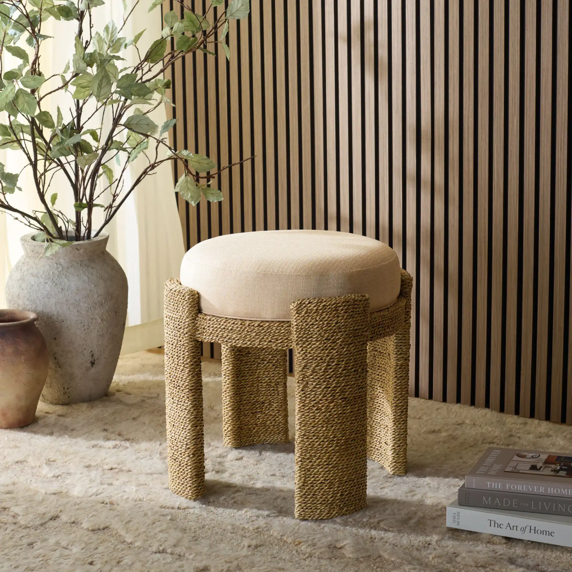 Grimaldi Seagrass Round Ottoman in Natural / Beige in a styled room