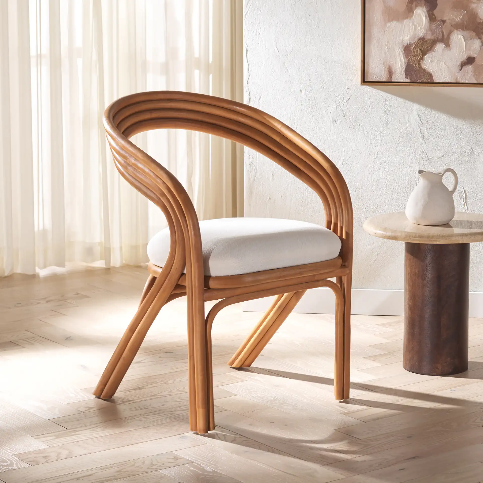 Jennabrook Rattan Dining Chair in Natural / White in a styled room