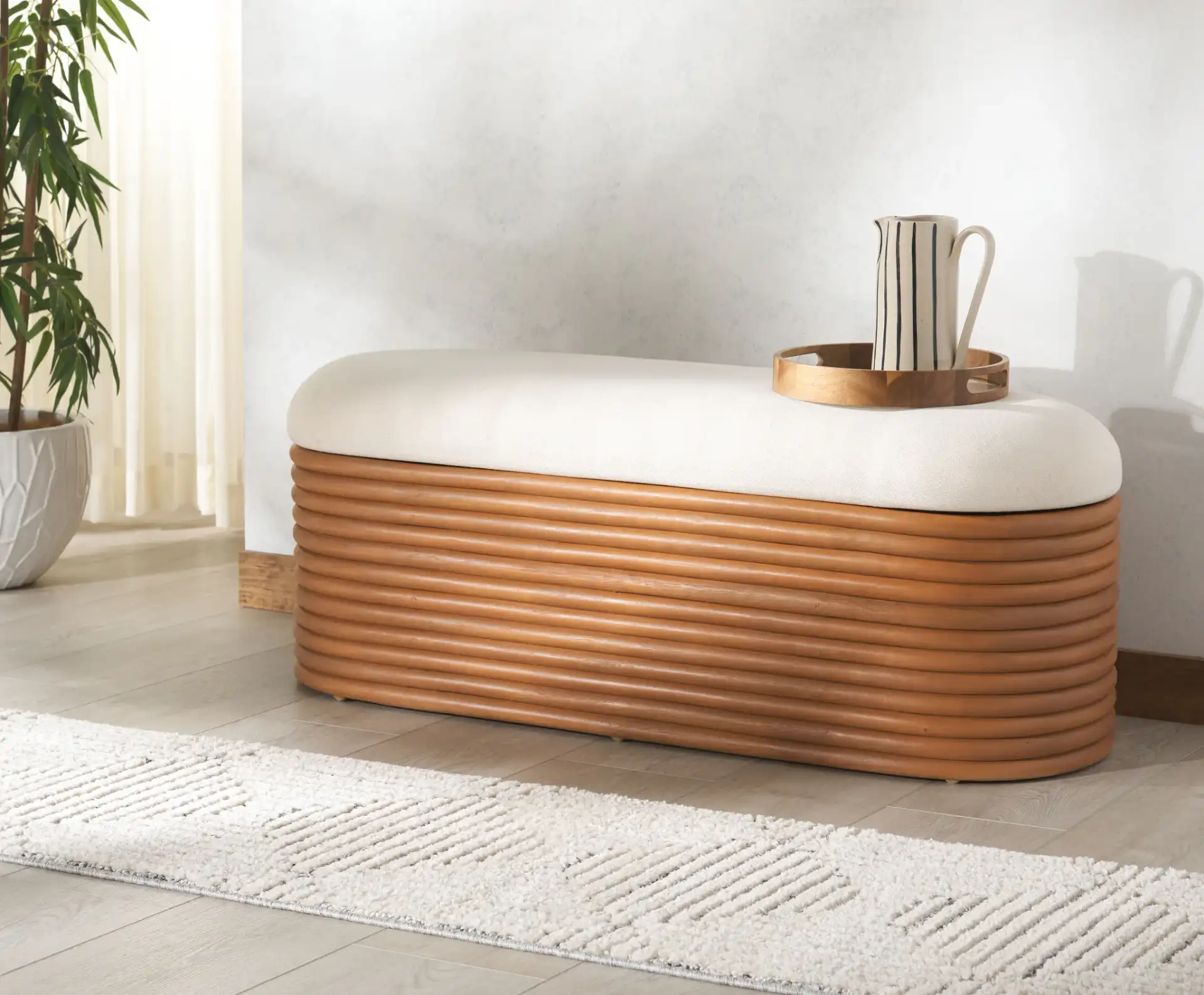 Bayard Rattan Storage Bench in Natural / White in a styled room