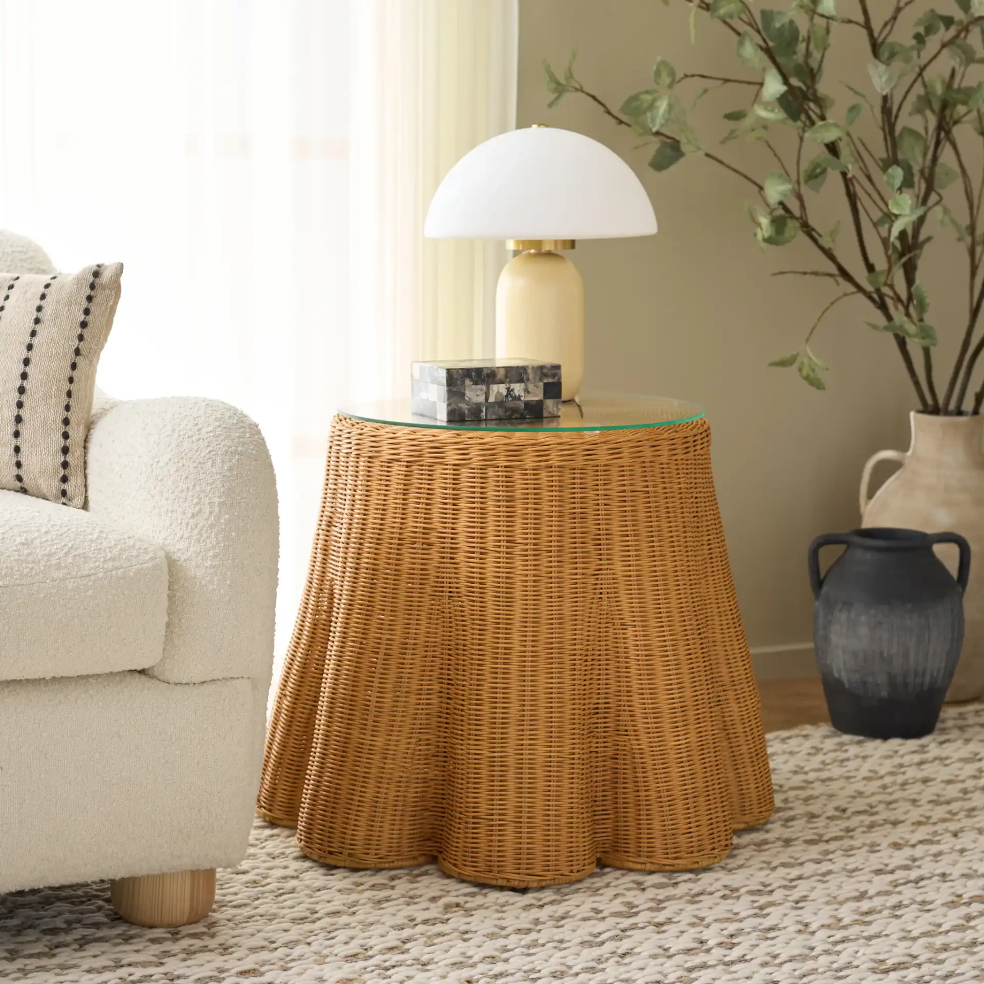 Hylda Round Rattan Accent Table in Natural in a styled room