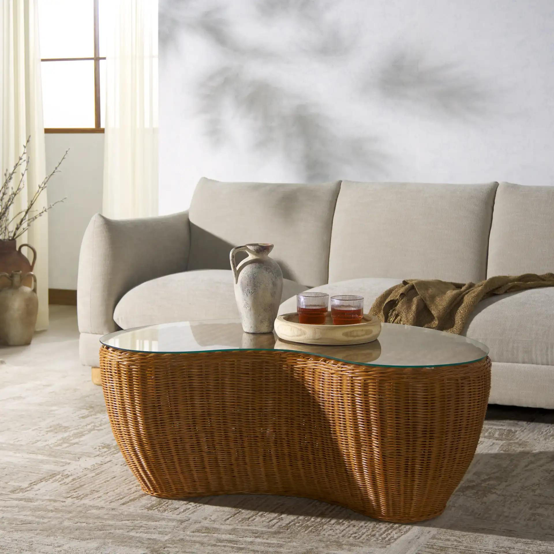 Hylda Rattan Coffee Table in Natural in a styled room