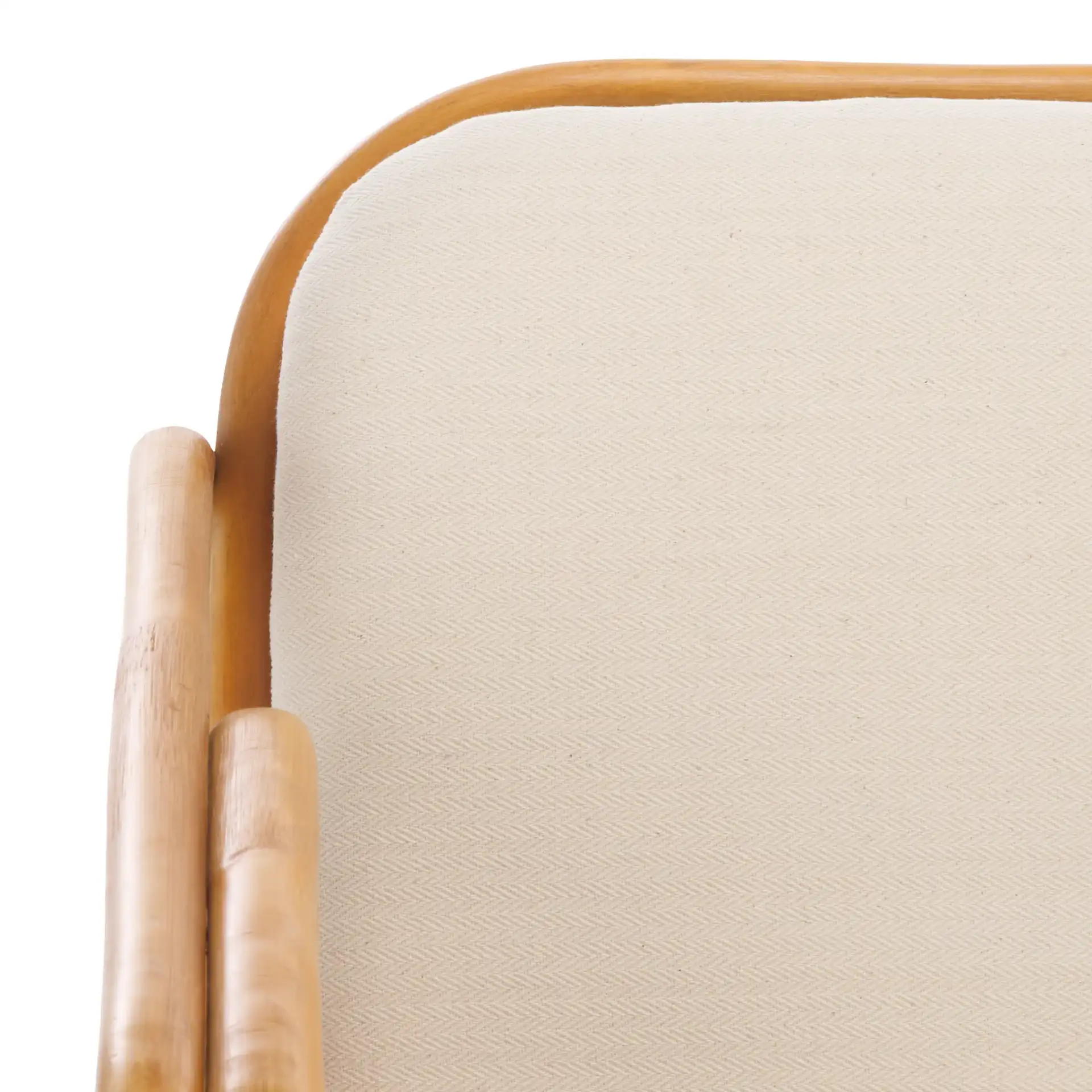 Brauner Rattan Pole Accent Chair in Natural / White in a styled room