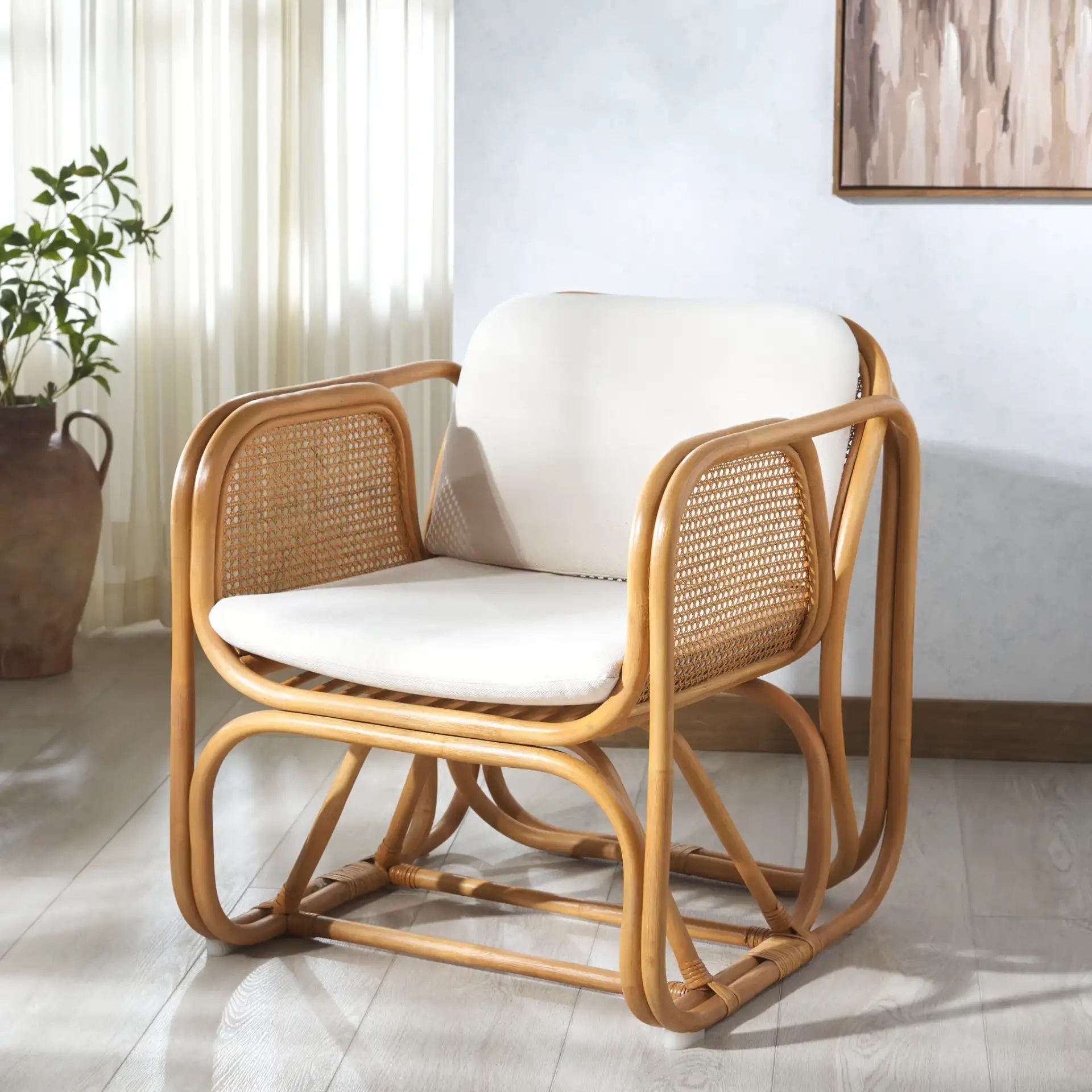 Brauner Rattan Pole Accent Chair in Natural / White in a styled room