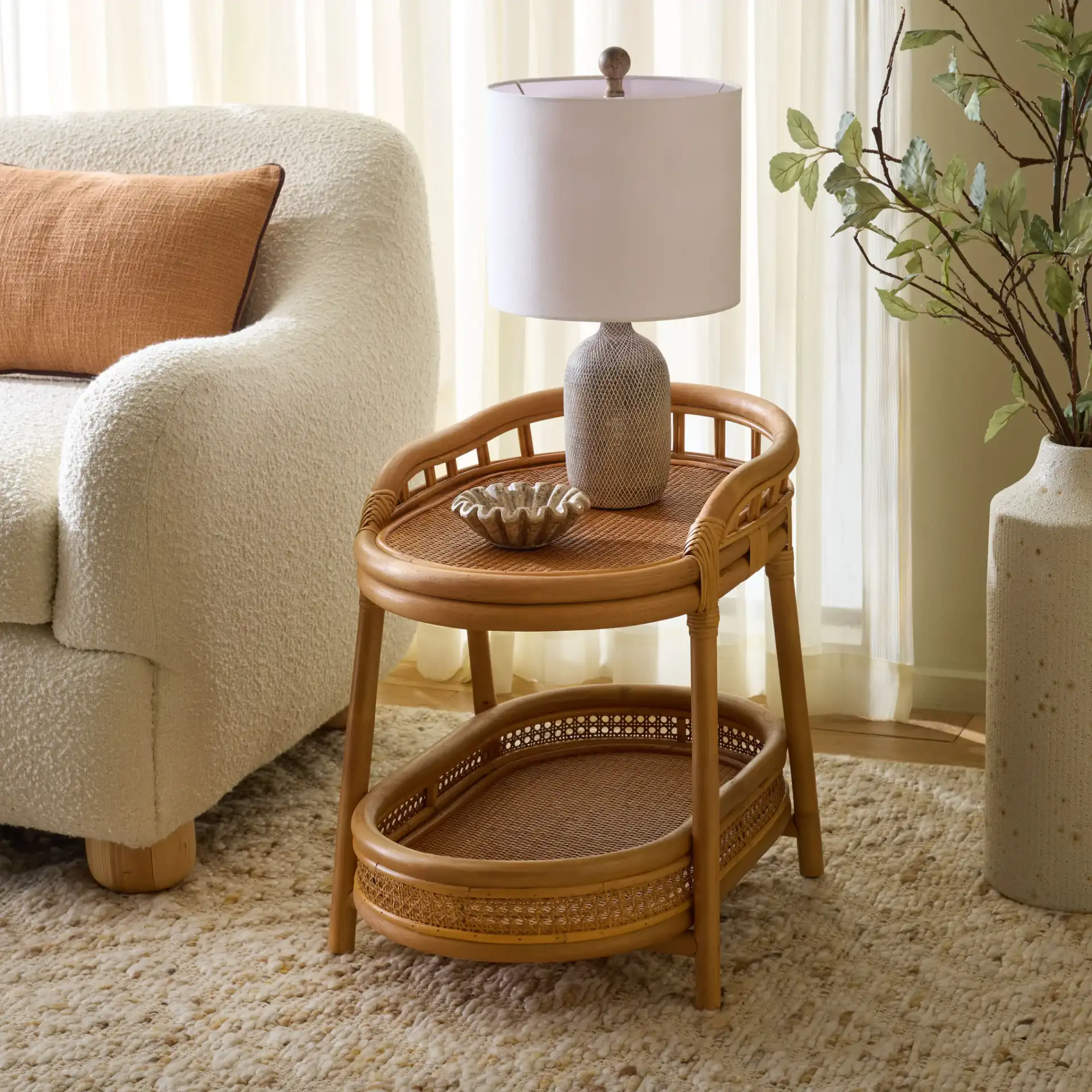 Shayleen Rattan Pole Accent Table in Natural in a styled room