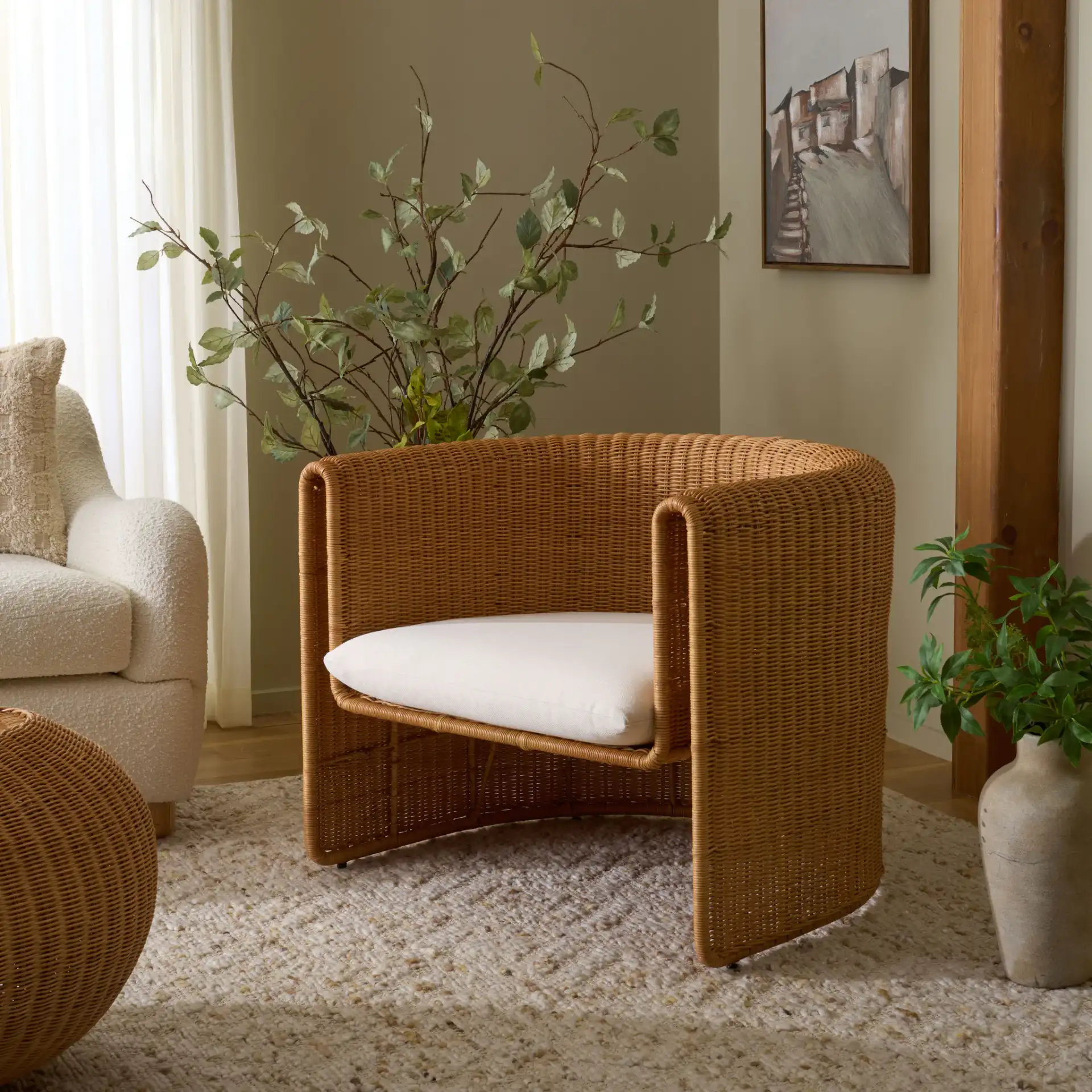 O'Reilly Rattan Accent Chair in Natural / White in a styled room