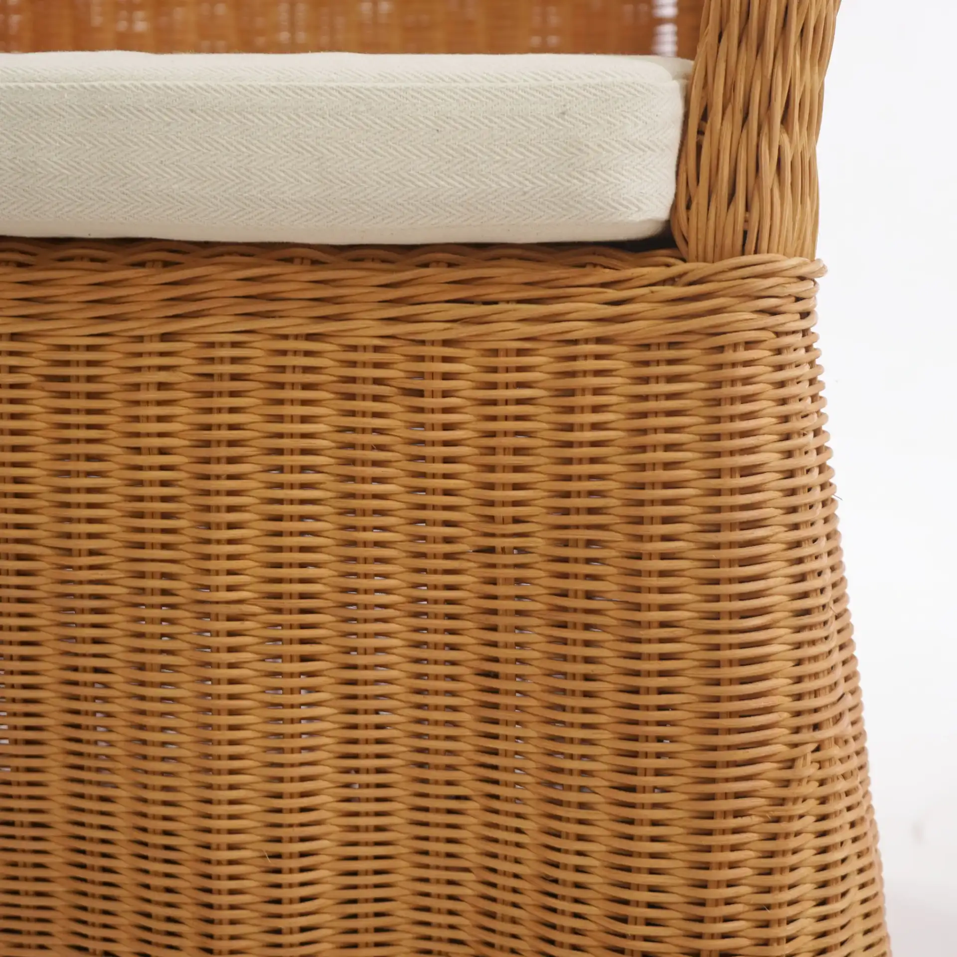 Hylda Rattan Dining Chair in Natural / White in a styled room