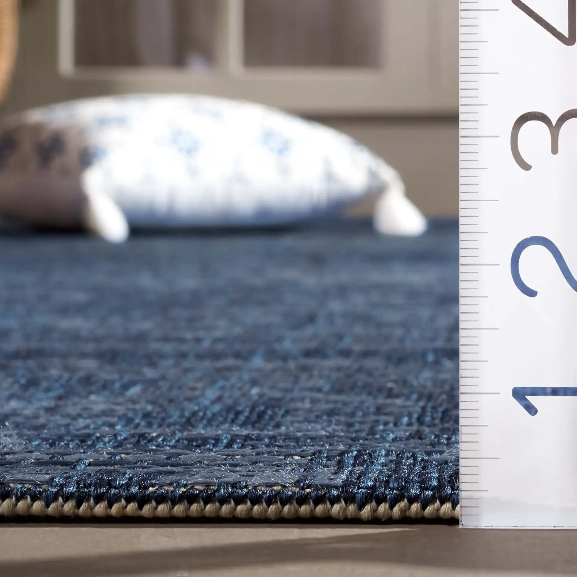 Courtyard Medallion Tile Outdoor Rug in Navy / Beige in a styled room
