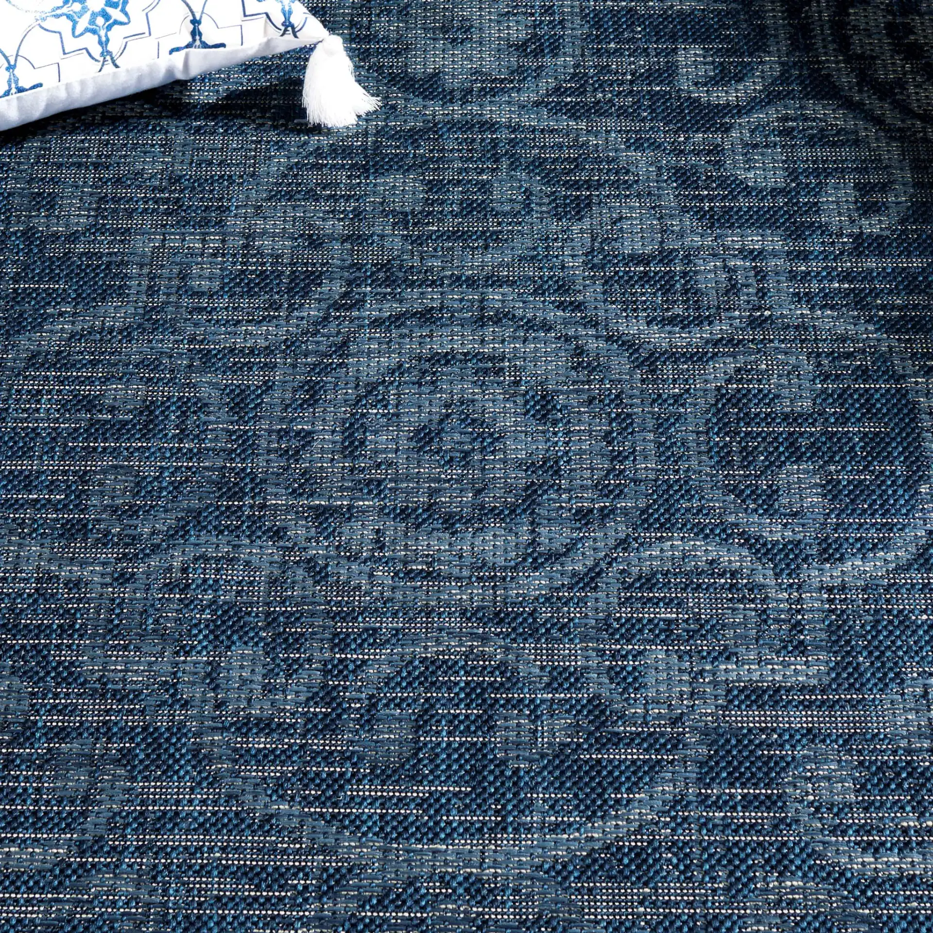 Courtyard Medallion Tile Outdoor Rug in Navy / Beige in a styled room