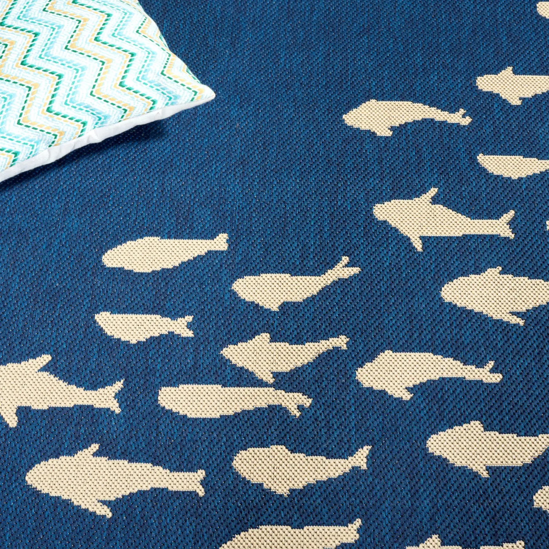 Courtyard School Of Fish Outdoor Rug in Navy / Beige in a styled room
