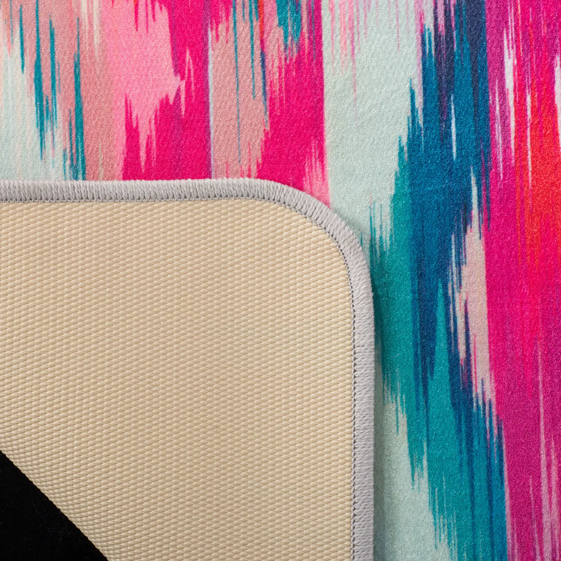Daytona Ikat Washable Rug in Fuchsia / Purple in a styled room
