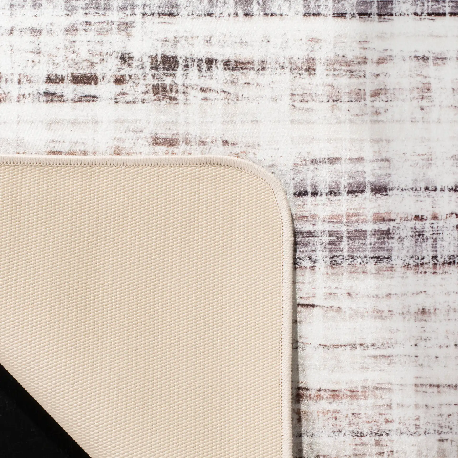 Daytona Crosshatch Washable Rug in Ivory / Gray in a styled room