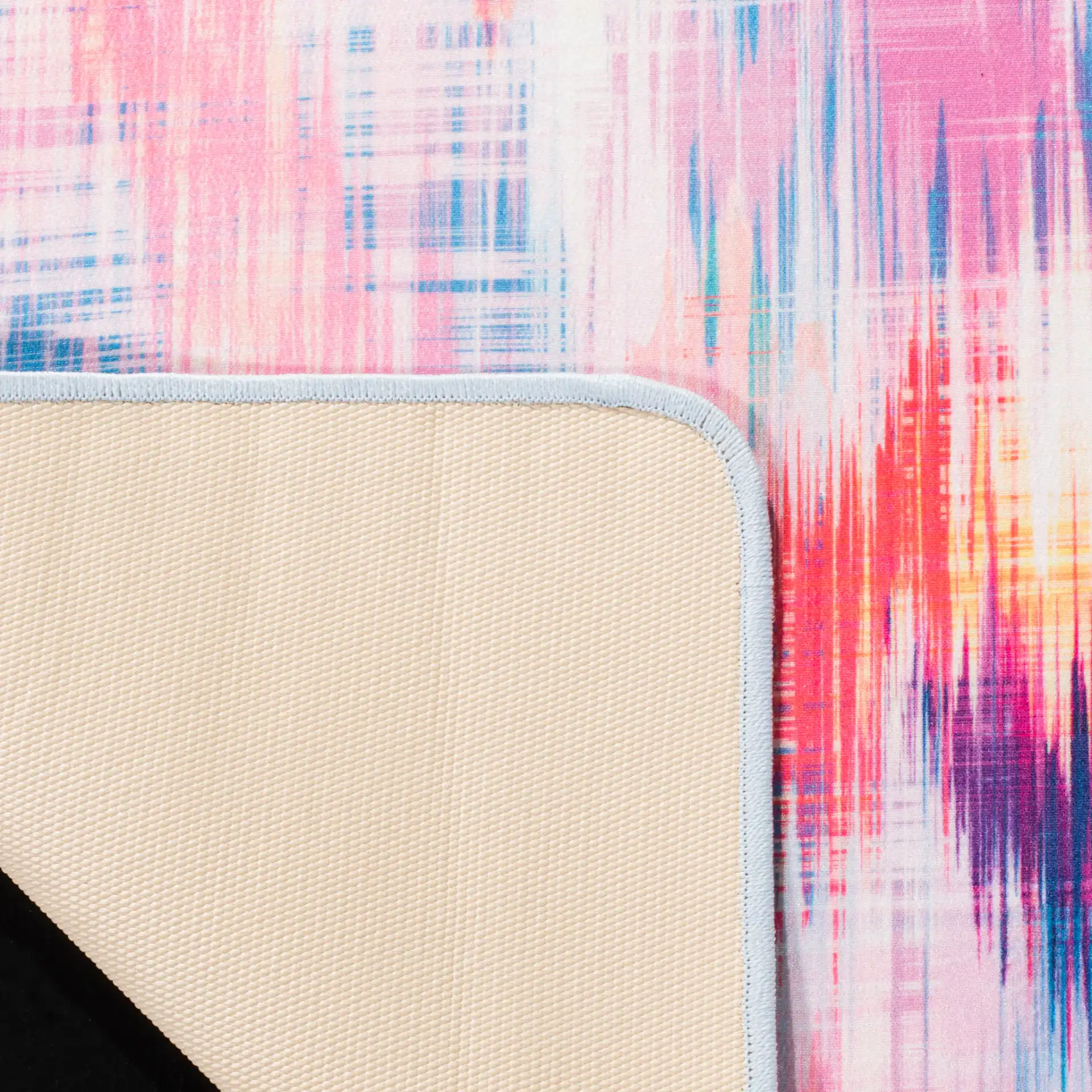 Daytona Ikat Diamond Washable Rug in Ivory / Pink in a styled room