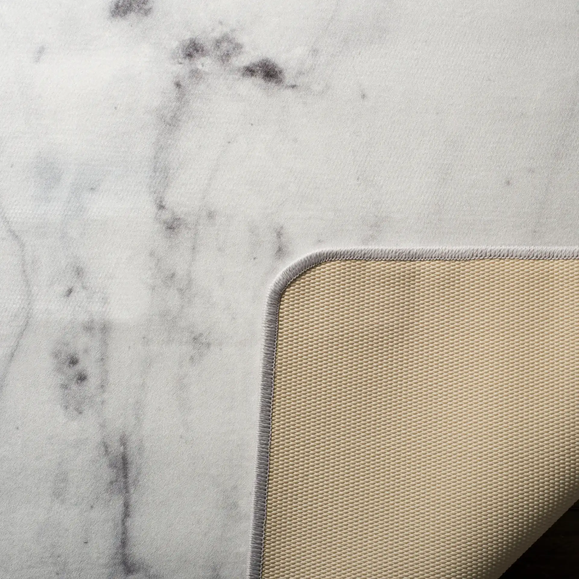 Daytona Marble Washable Rug in Ivory / Gray in a styled room
