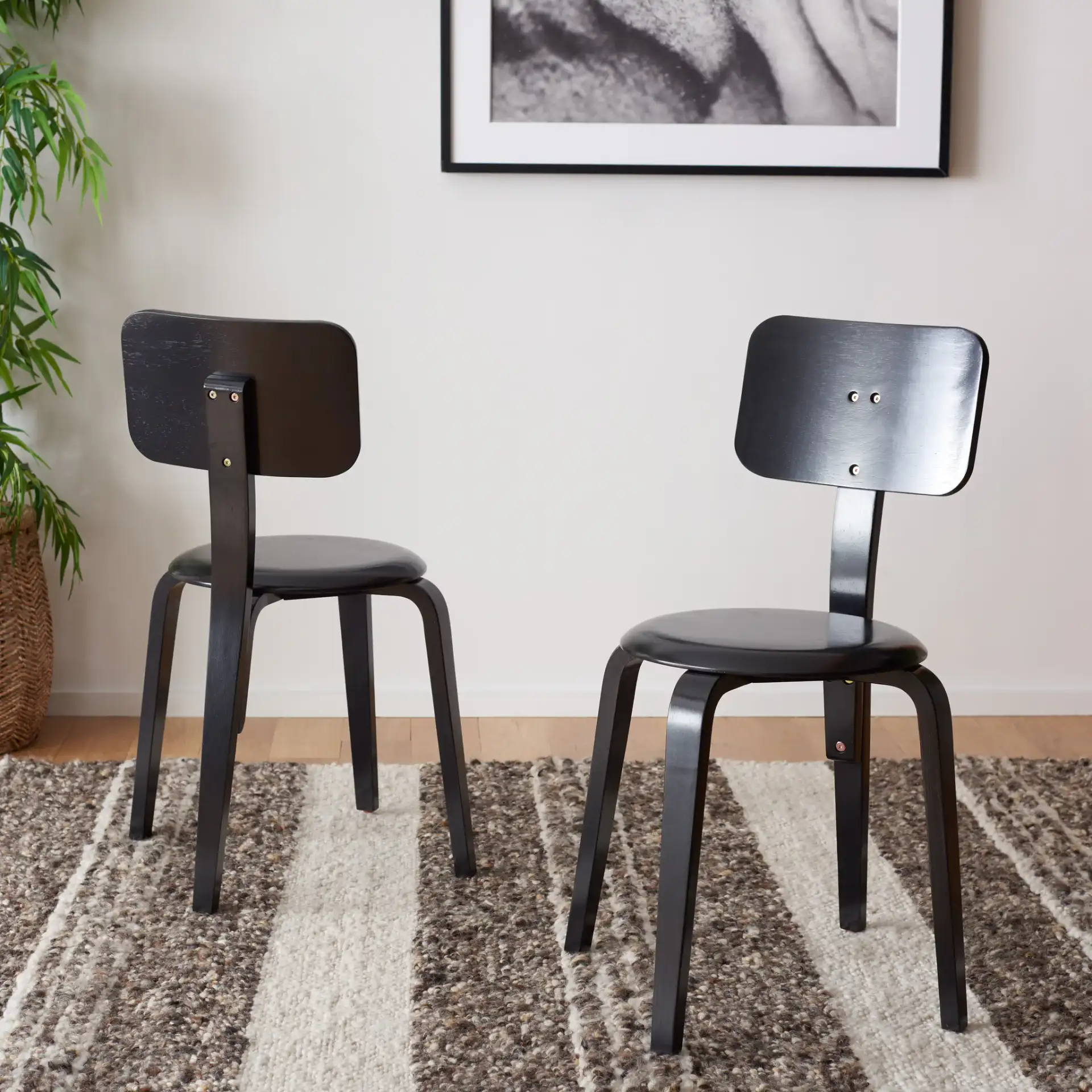 Luella Stackable Dining Chair (Set of 2) in Black in a styled room