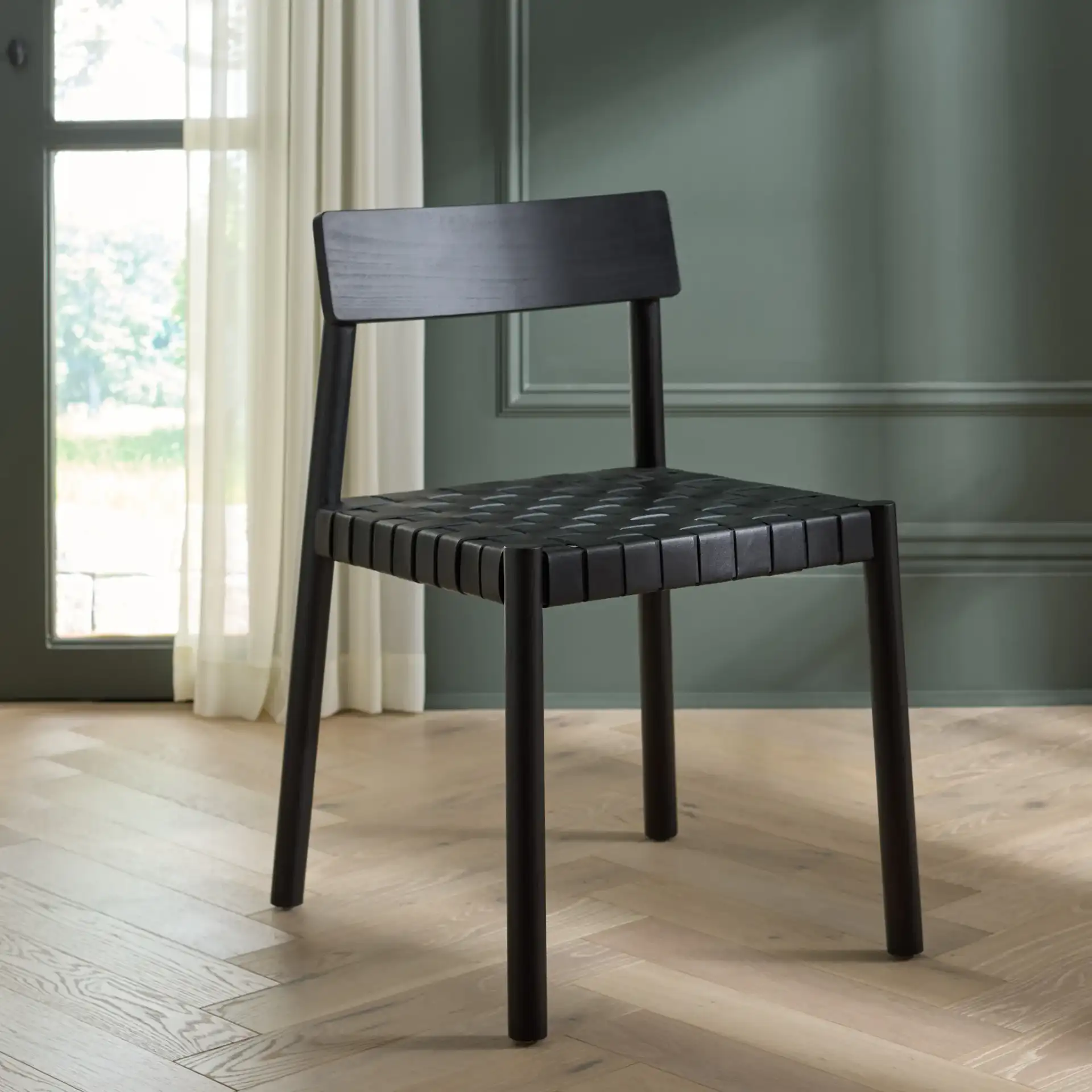 Tyde Dining Chair in Black in a styled room
