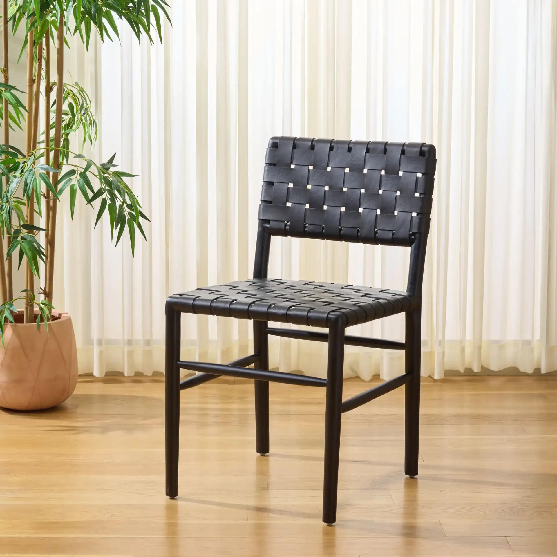 Kaiber Dining Chair in Black in a styled room