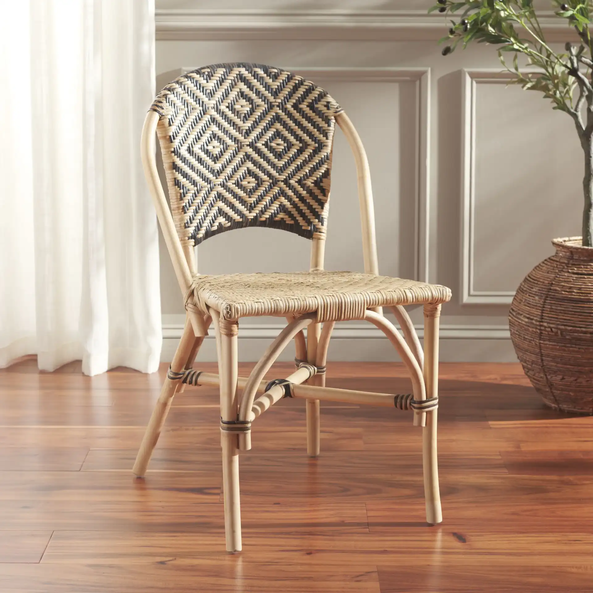 Callidora Dining Chair in Natural / Black in a styled room