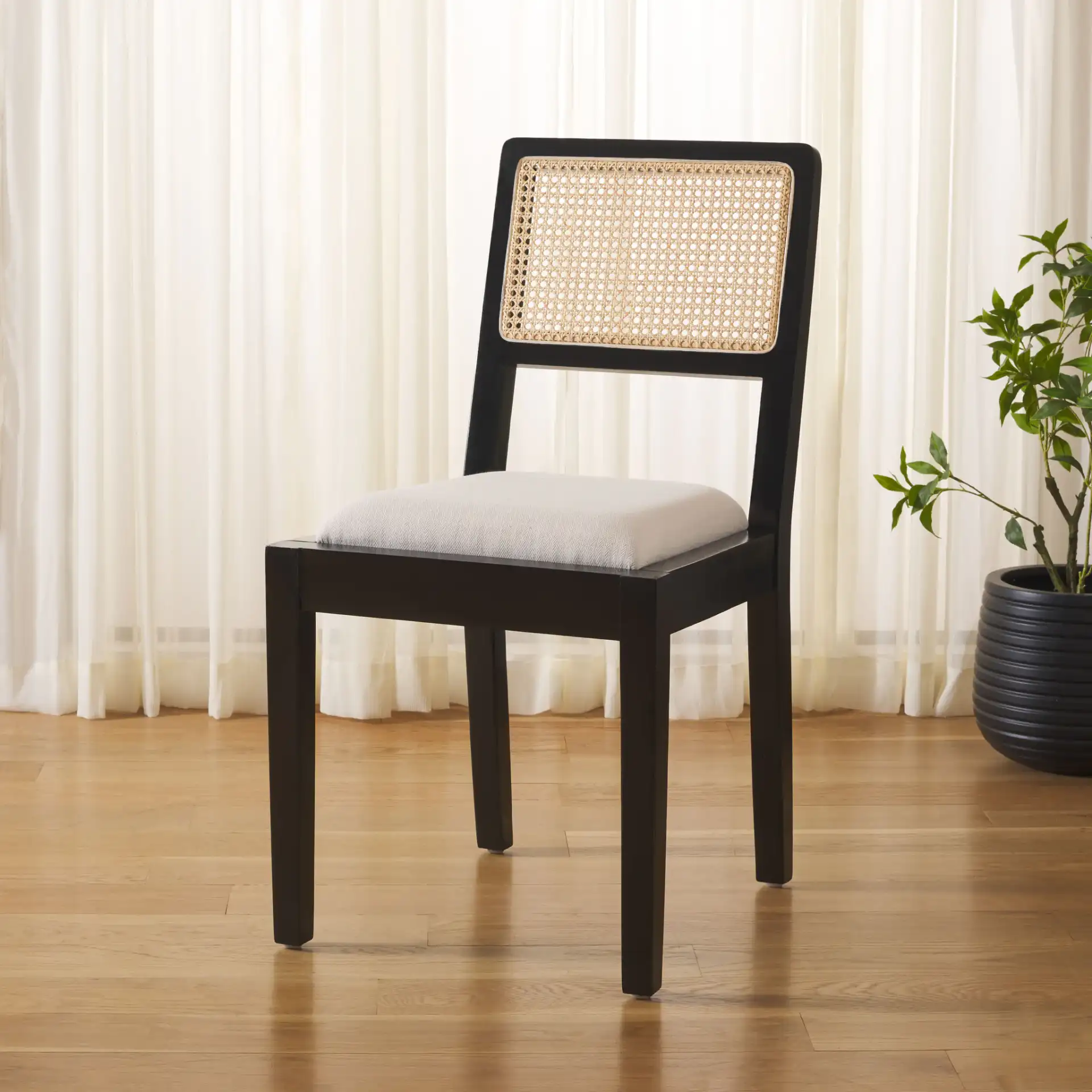 Suzetta Dining Chair in Natural / White in a styled room