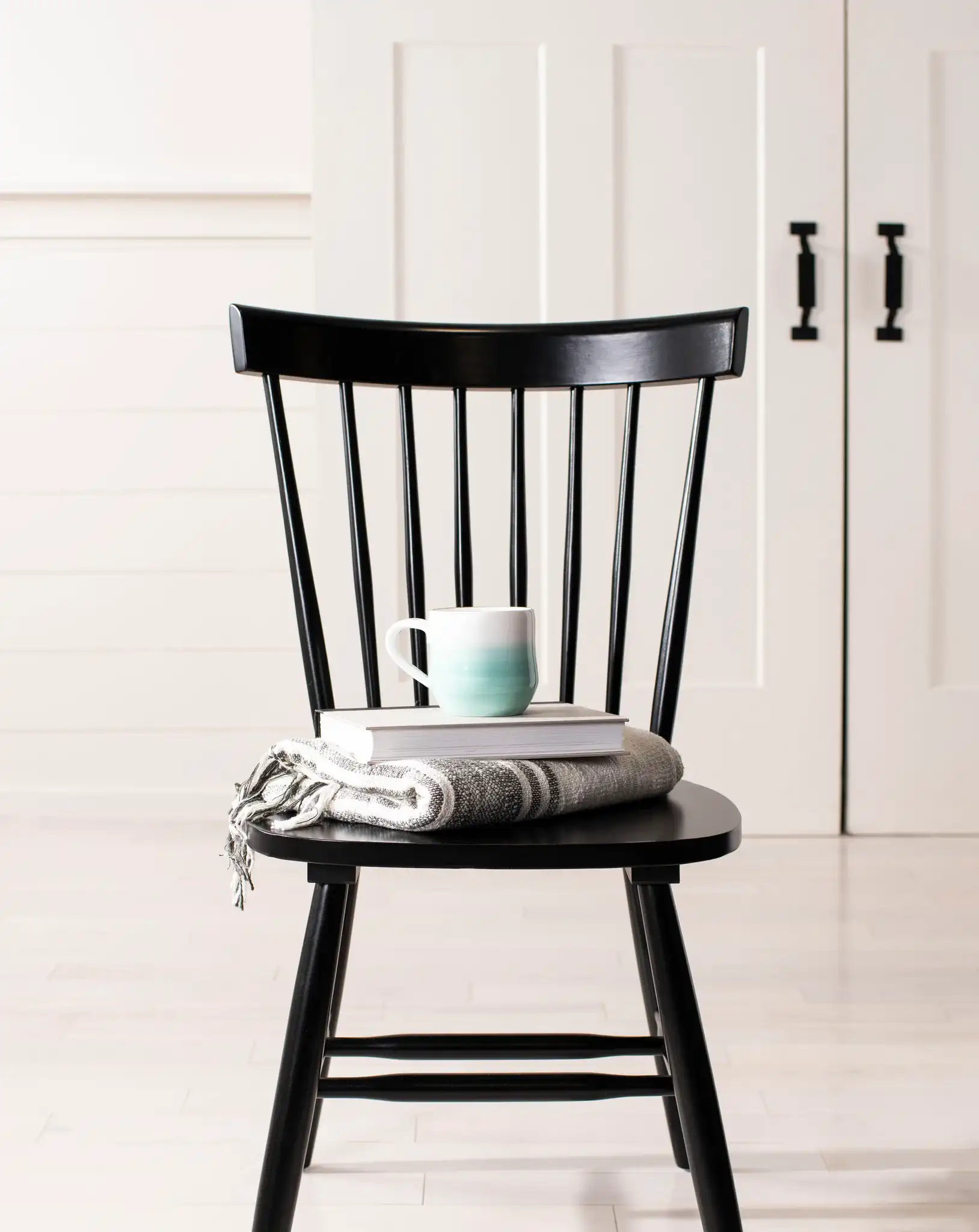 Novalyn Dining Chairs (Set Of 2) in Black in a styled room