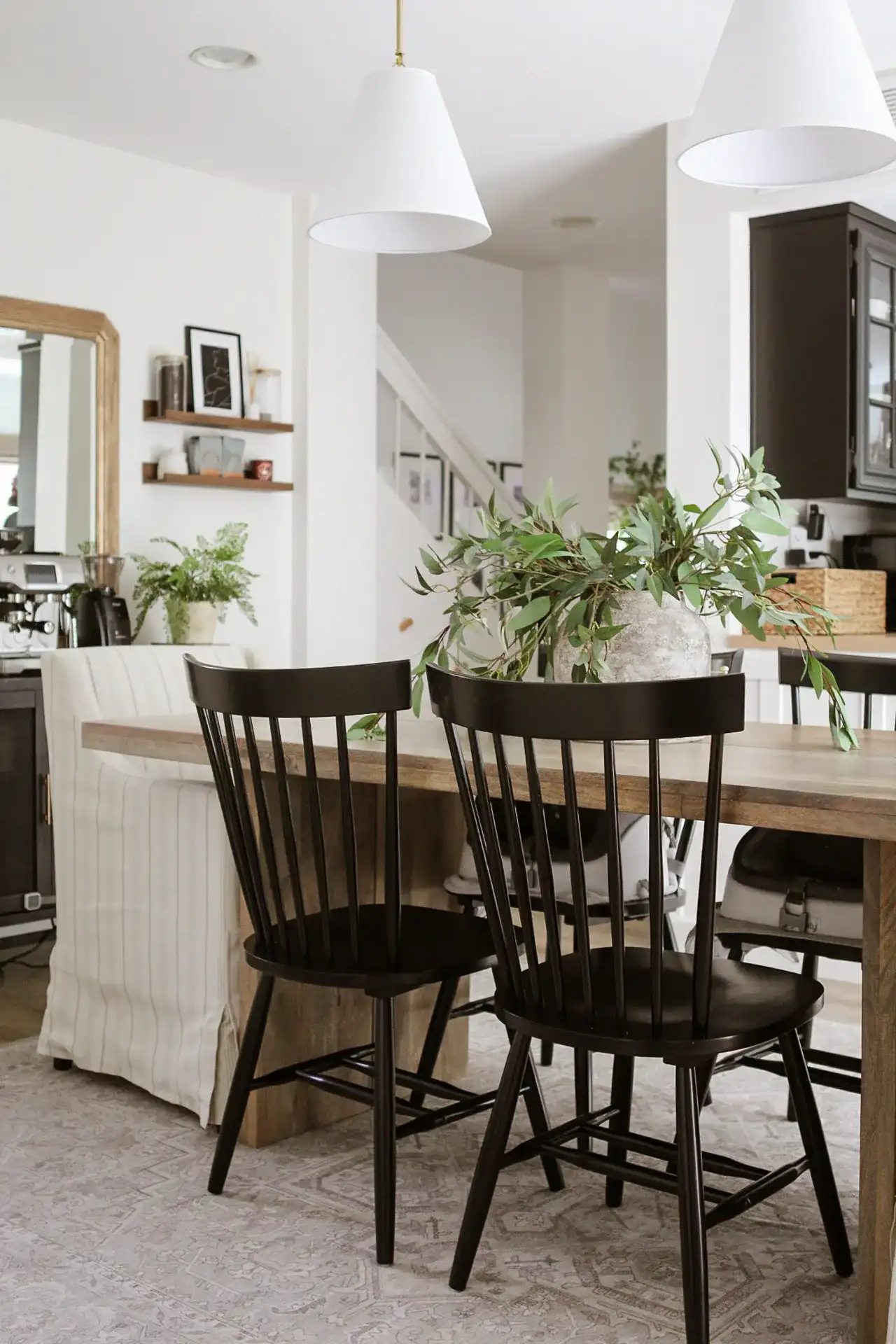 Novalyn Dining Chairs (Set Of 2) in Black in a styled room