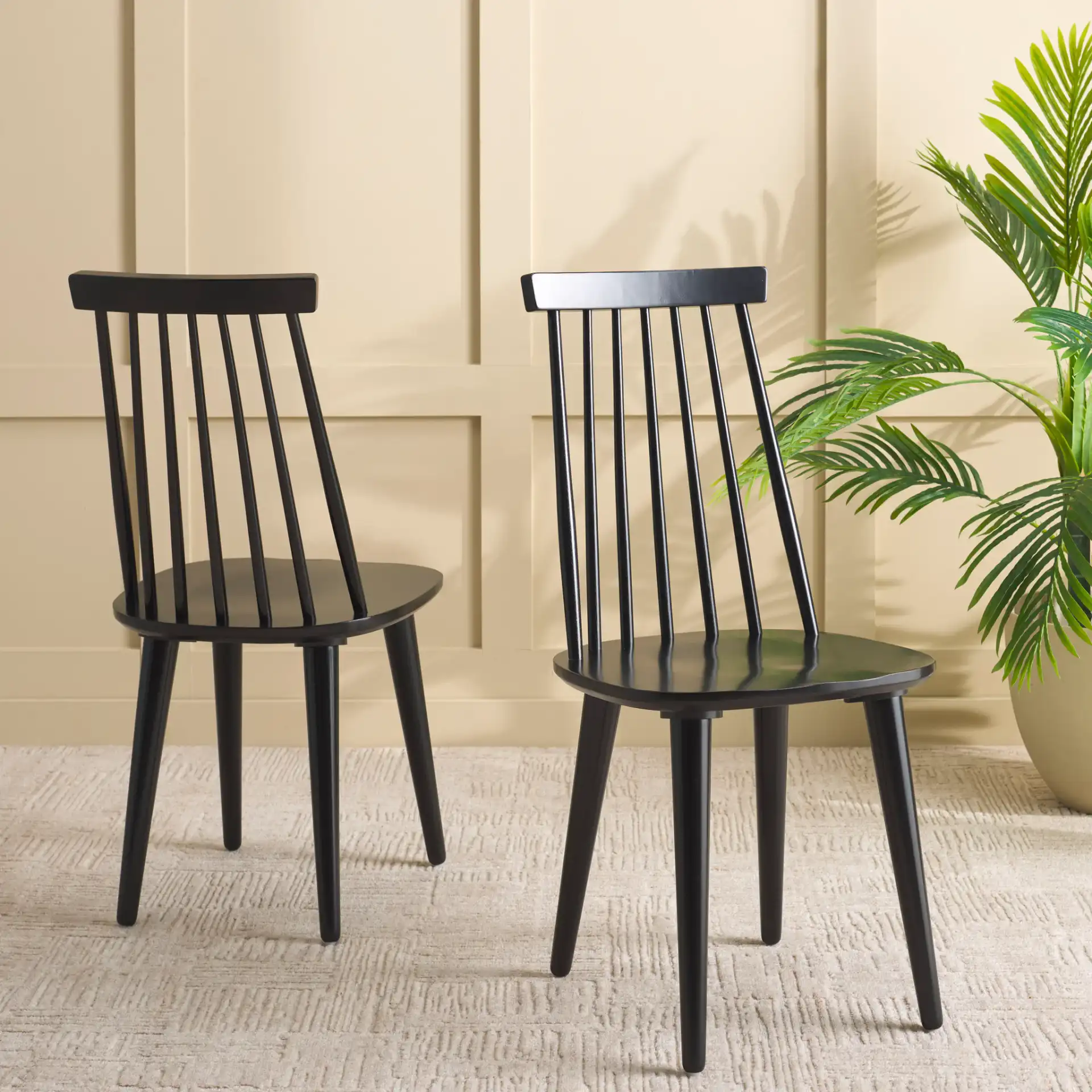 Raylin Dining Chairs (Set of 2) in Black in a styled room