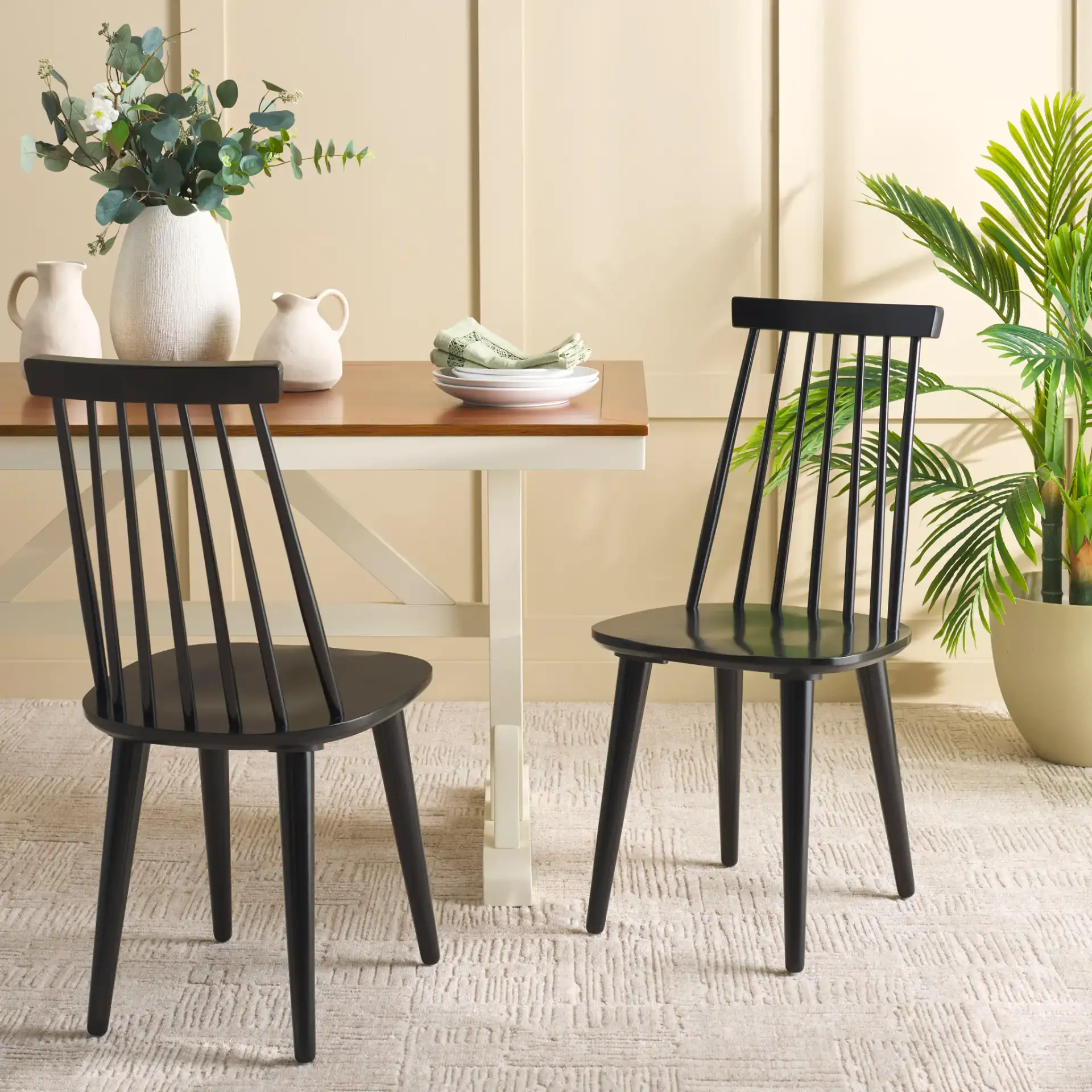 Raylin Dining Chairs (Set of 2) in Black in a styled room