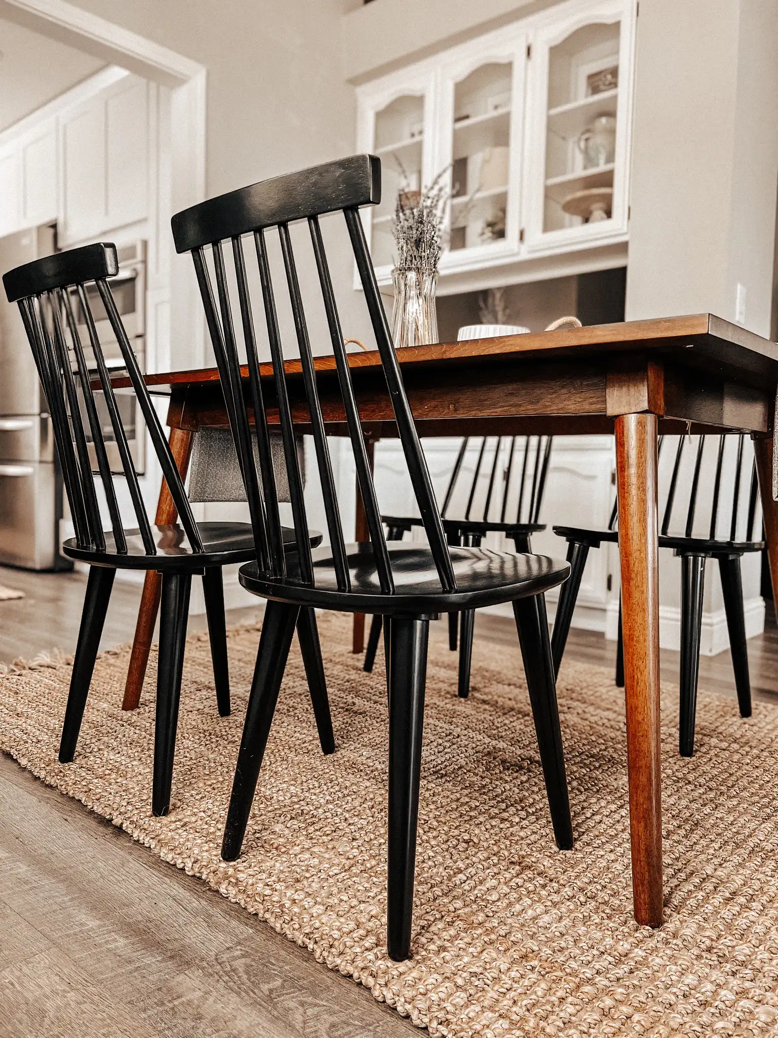 Raylin Dining Chairs (Set of 2) in Black in a styled room
