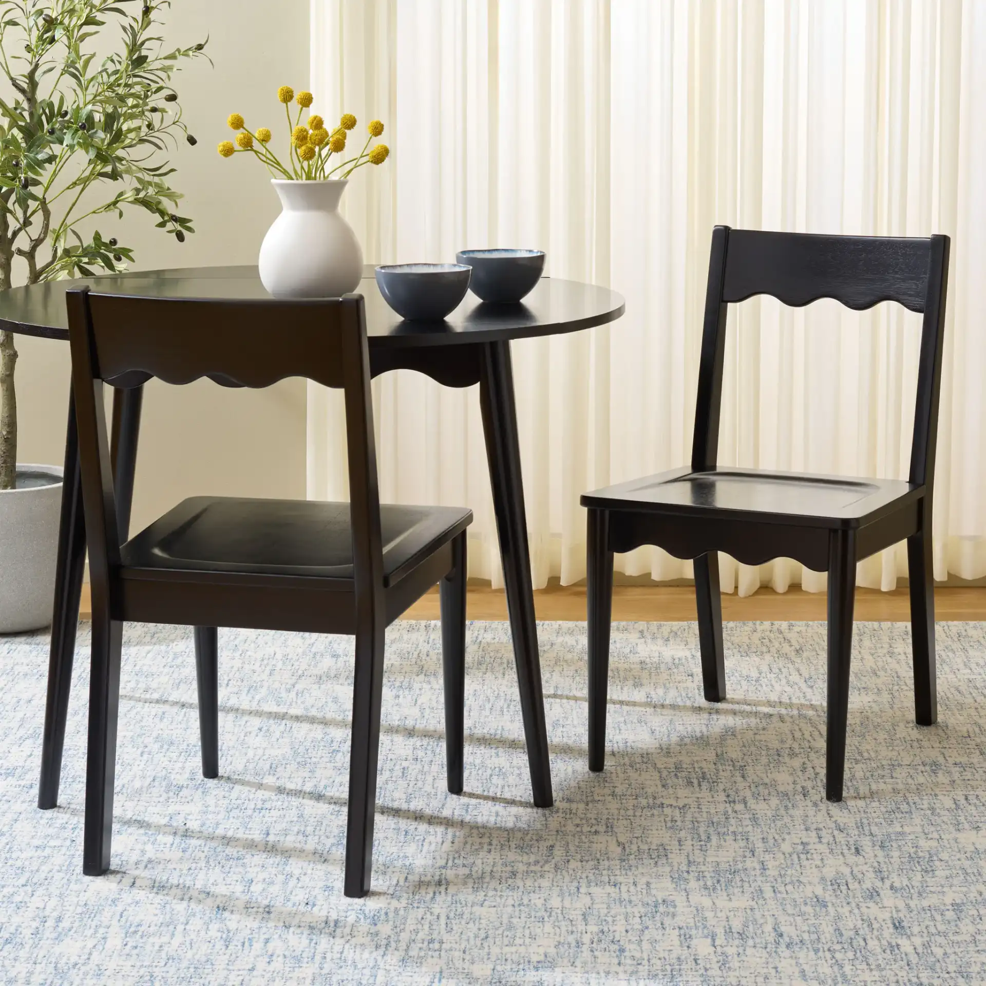 Rosetty Scallop Dining Chairs (Set Of 2) in Black in a styled room