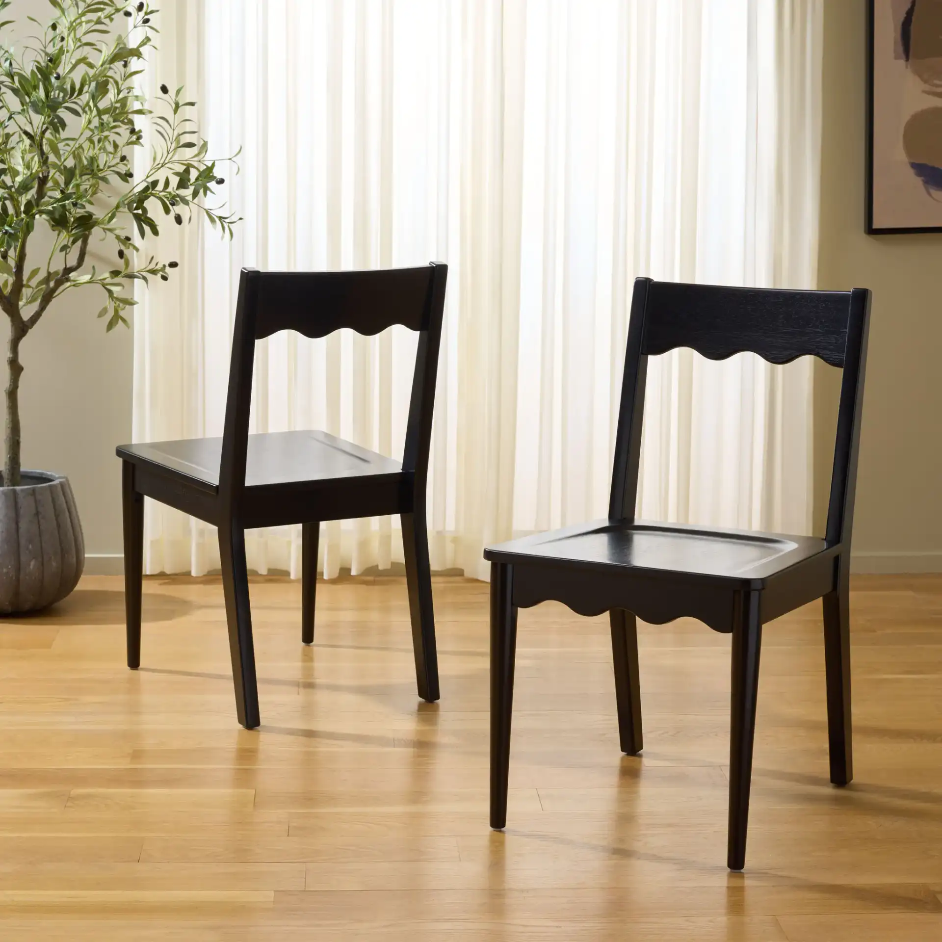Rosetty Scallop Dining Chairs (Set Of 2) in Black in a styled room