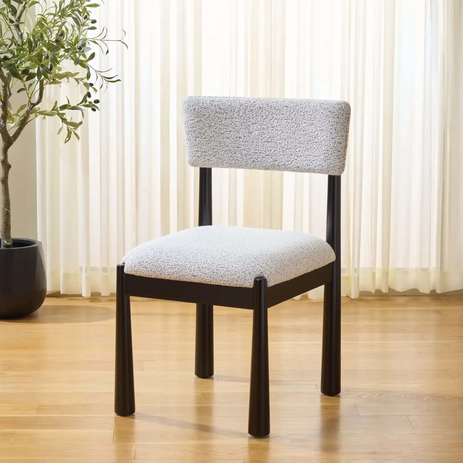 Koki Dining Chair in Black / White in a styled room
