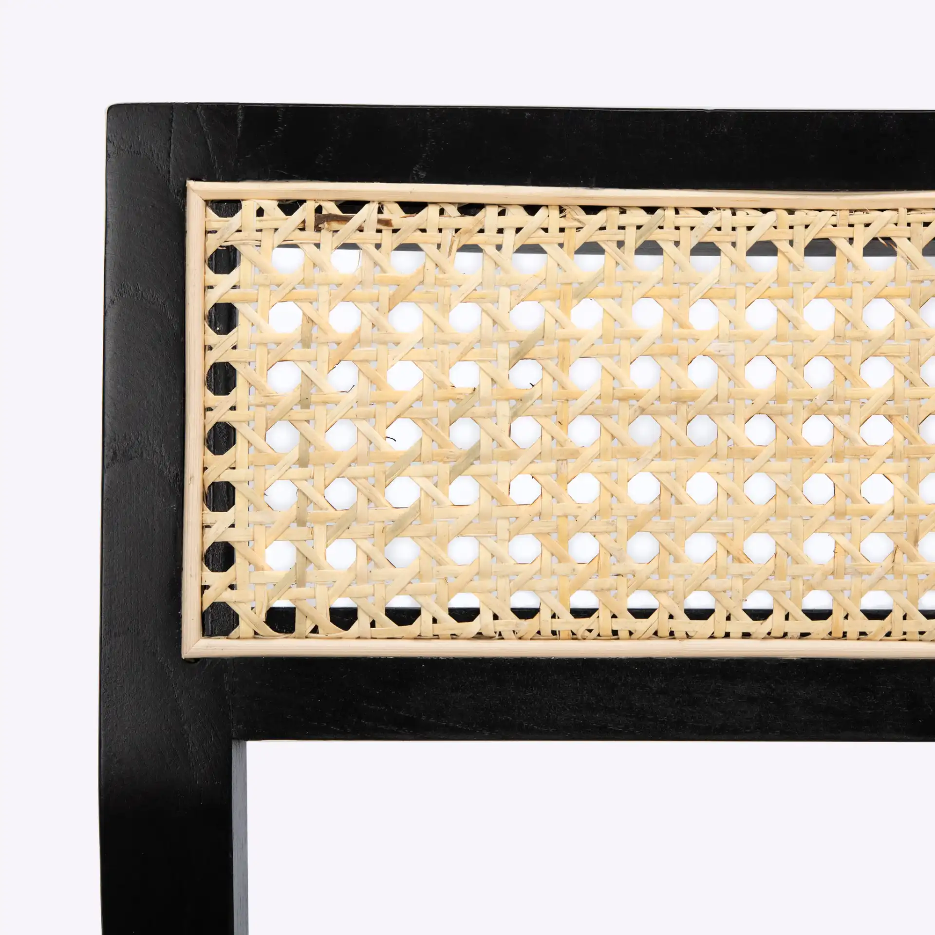Bernice Cane Dining Chair in Black / Natural in a styled room