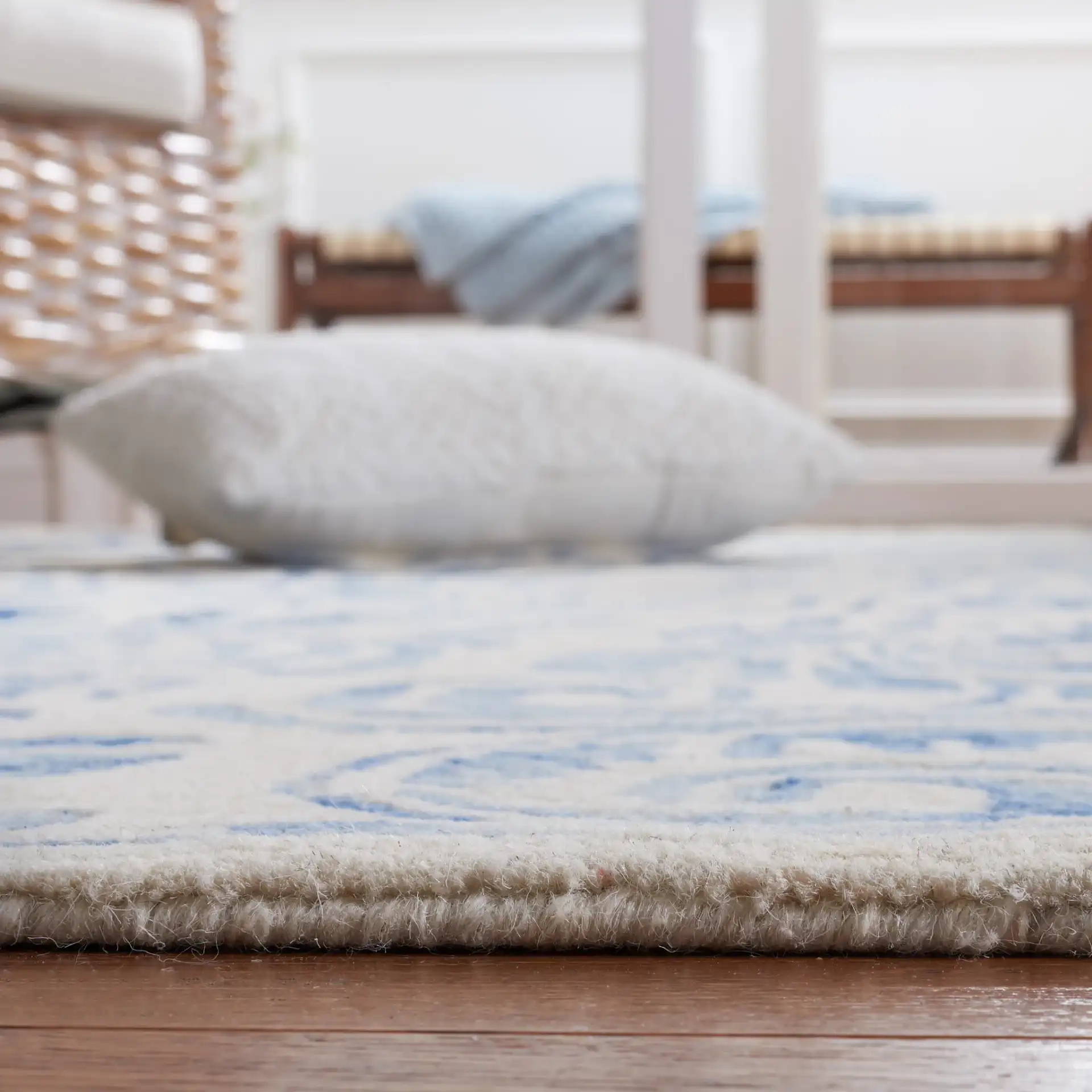 Dip Dye Scrollwork Hand-Tufted Wool Rug in Blue / Ivory in a styled room