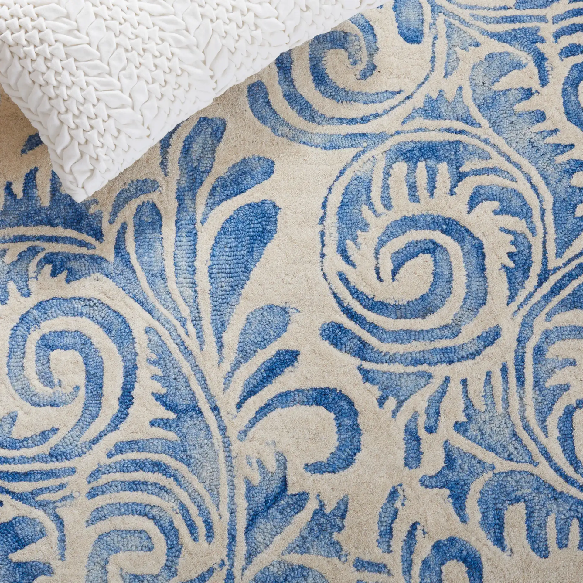 Dip Dye Scrollwork Hand-Tufted Wool Rug in Blue / Ivory in a styled room
