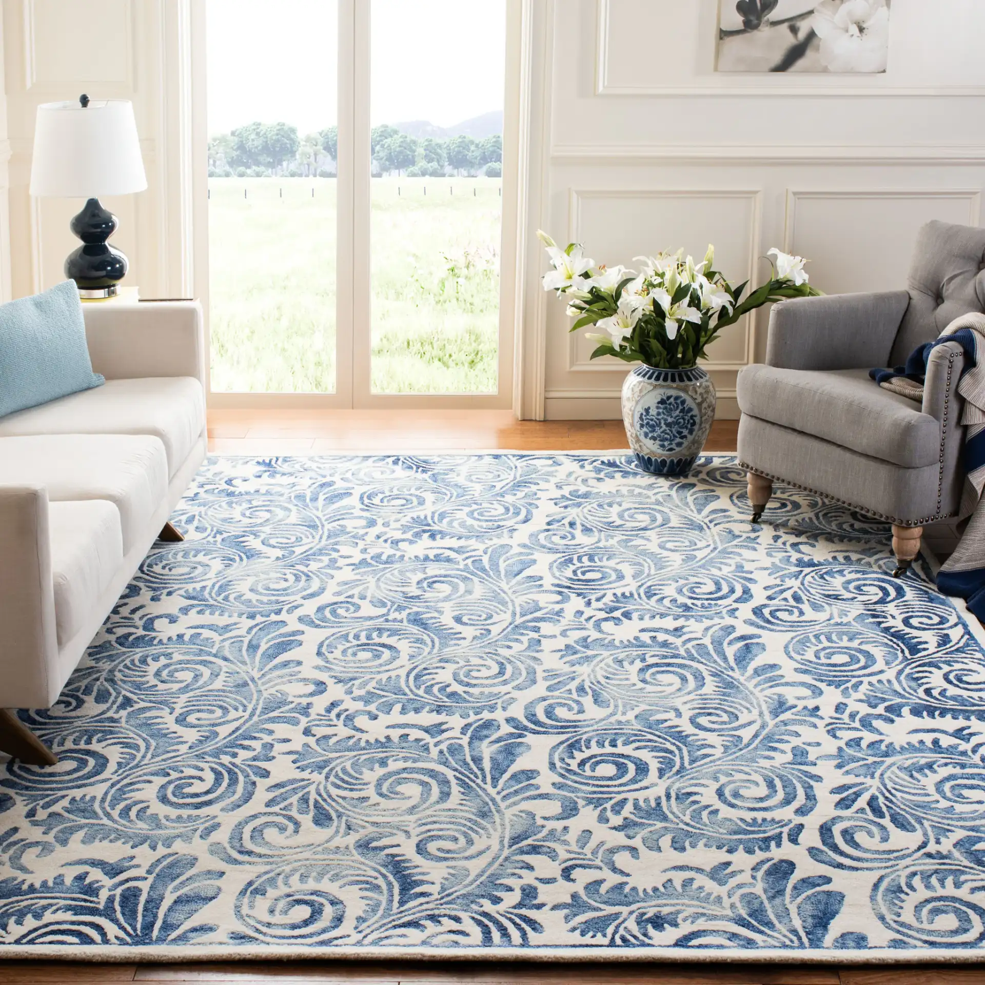 Dip Dye Scrollwork Hand-Tufted Wool Rug in Blue / Ivory in a styled room