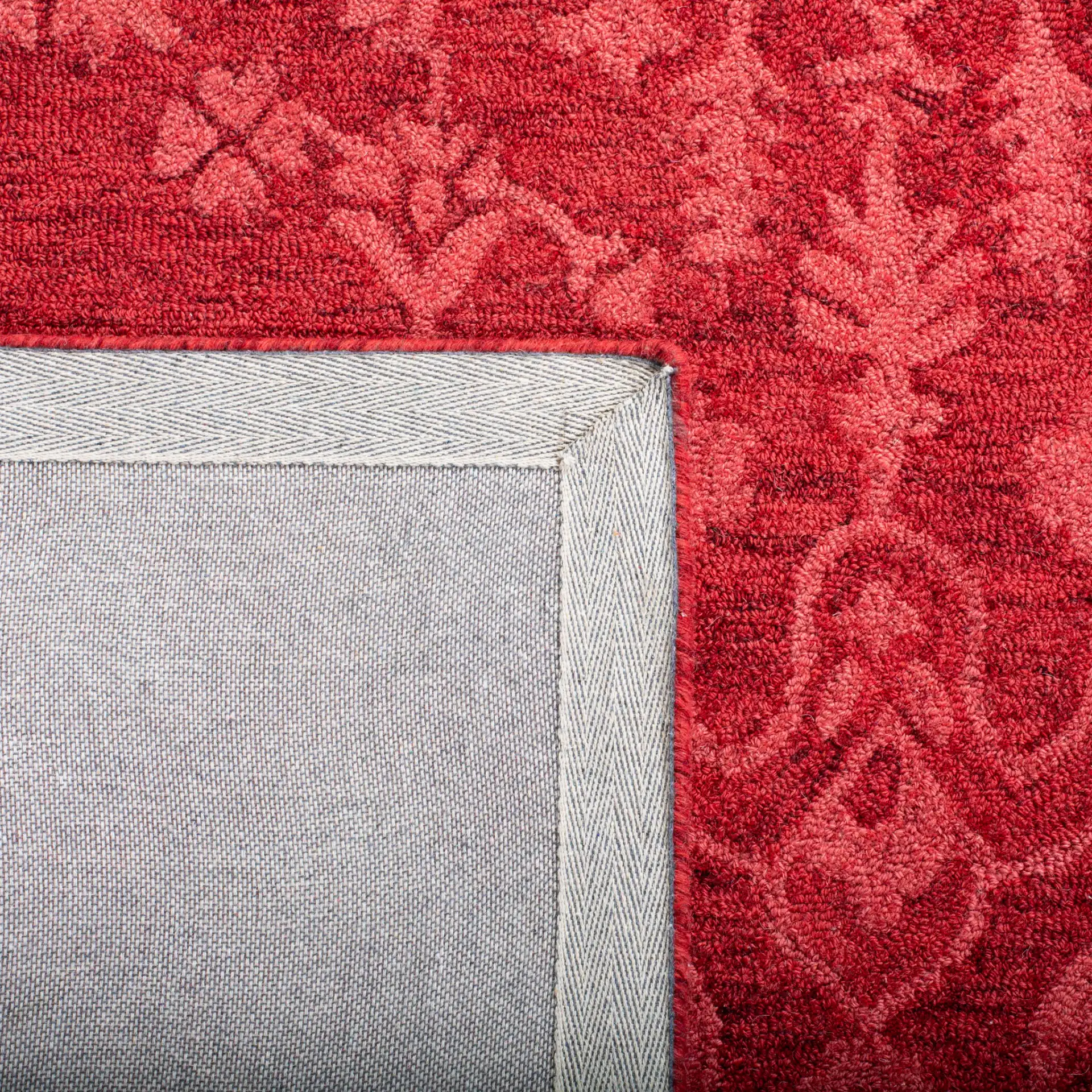 Dip Dye Bordered Medallion Hand-Tufted Wool Rug in Red in a styled room