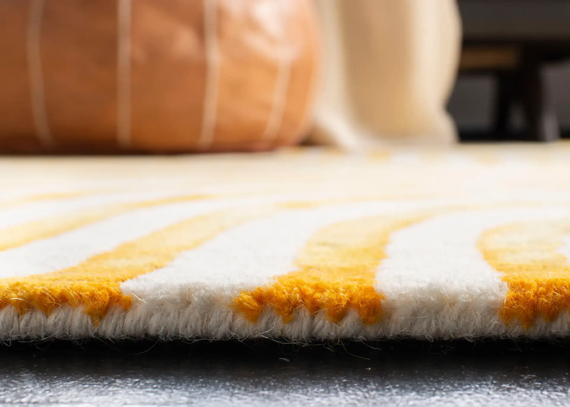 Dip Dye Wavy Stripe Hand-Tufted Rug in Ivory / Terracotta in a styled room