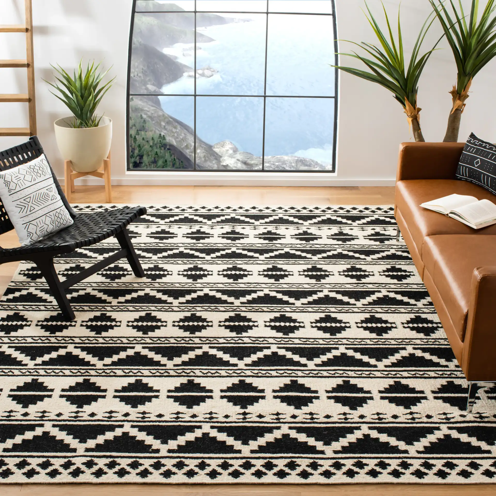 Dhurries Banded Geometric Hand-Woven Wool Rug in Black / Ivory in a styled room