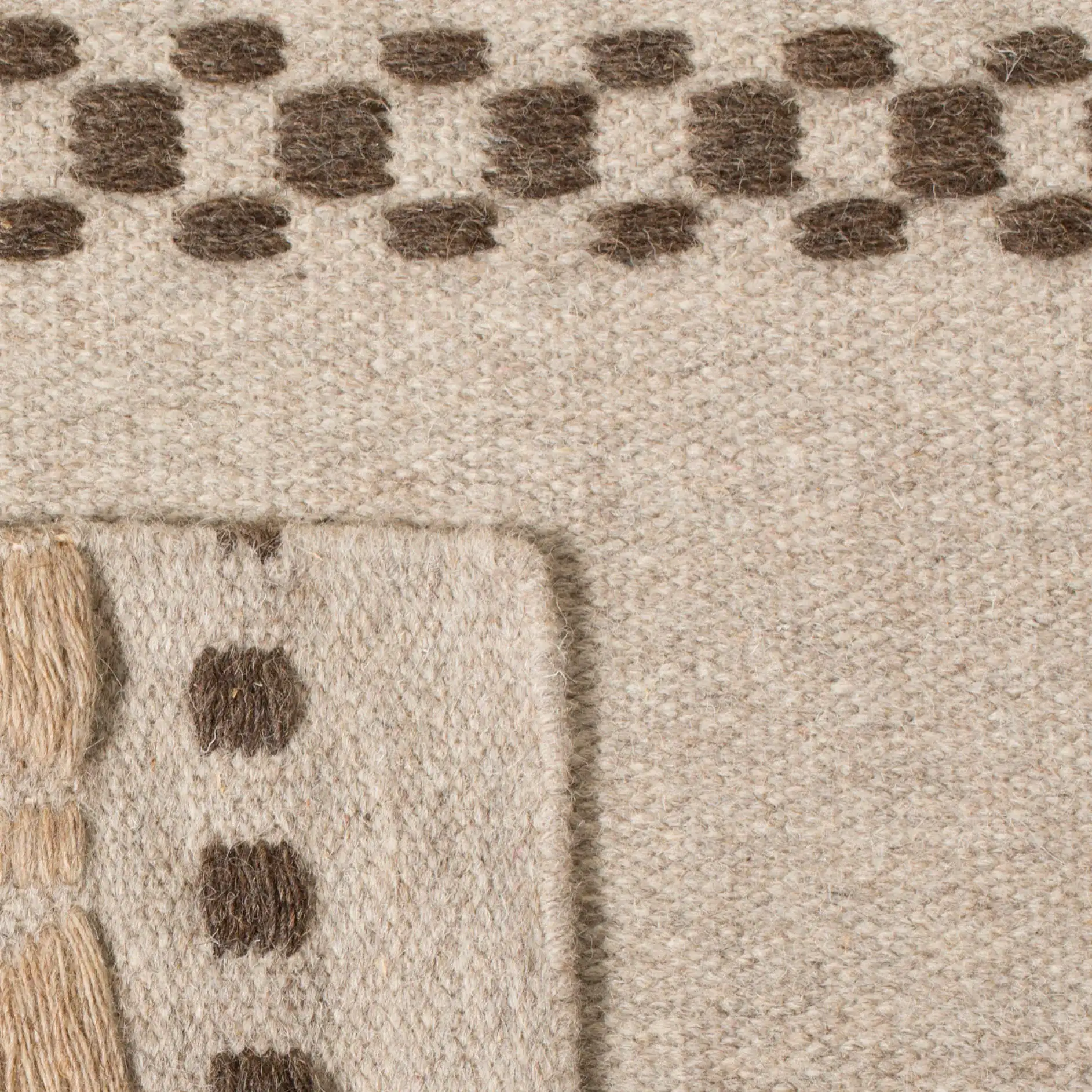 Dhurries Banded Diamond Hand-Woven Wool Rug in Natural in a styled room