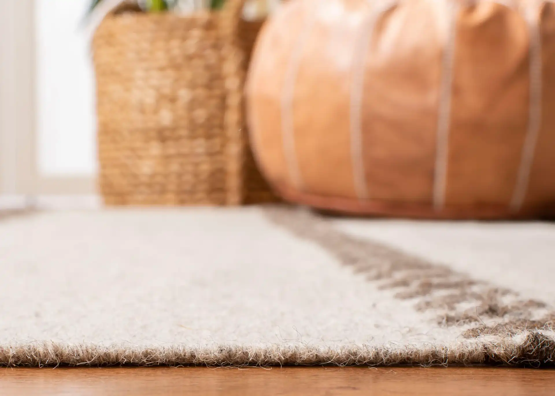 Dhurries Banded Diamond Hand-Woven Wool Rug in Natural in a styled room