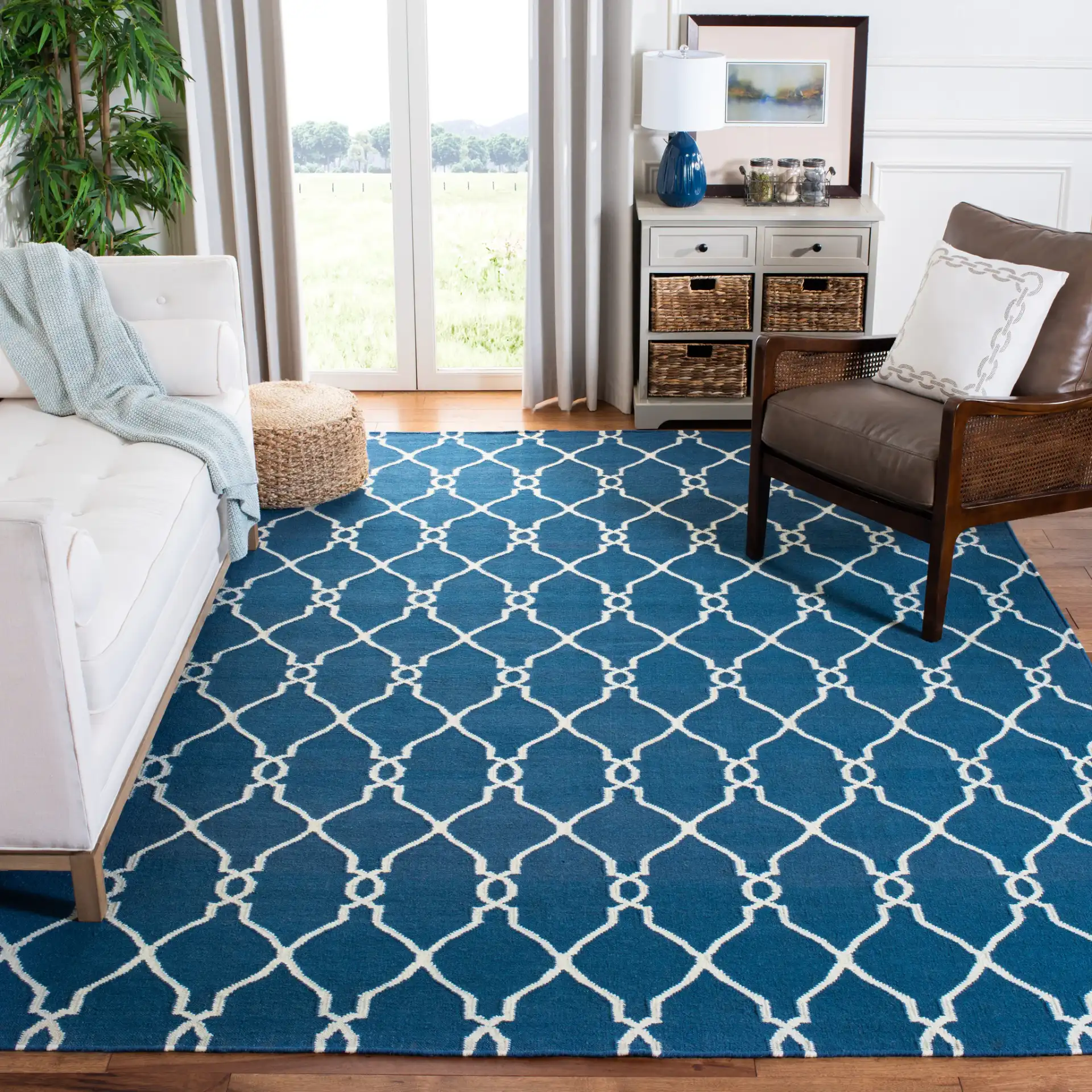 Dhurries Linked Trellis Hand-Woven Wool Rug in Dark Blue in a styled room