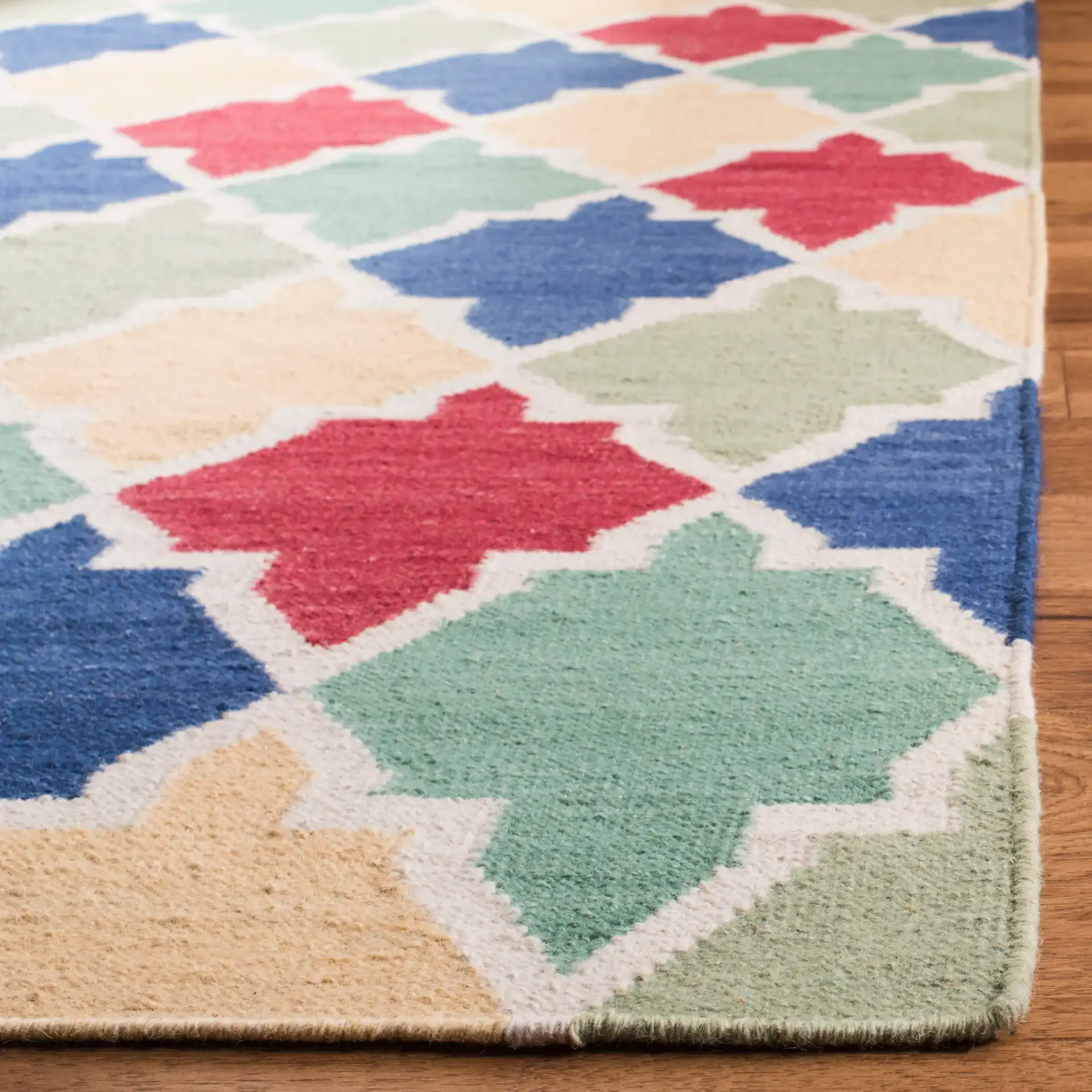 Dhurries Ogee Tile Hand-Woven Rug in Blue / Multicolor in a styled room