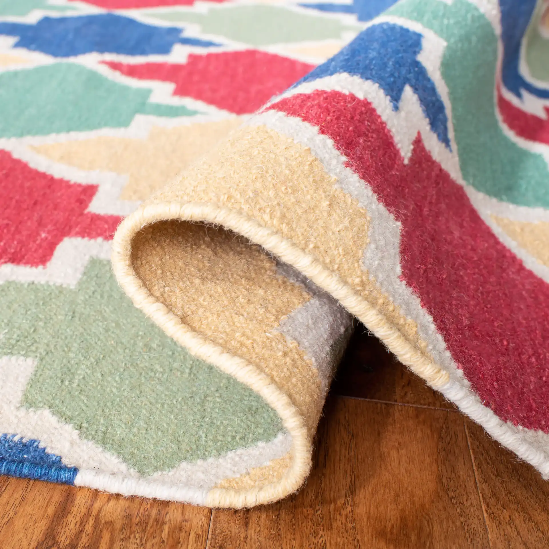 Dhurries Ogee Tile Hand-Woven Rug in Blue / Multicolor in a styled room