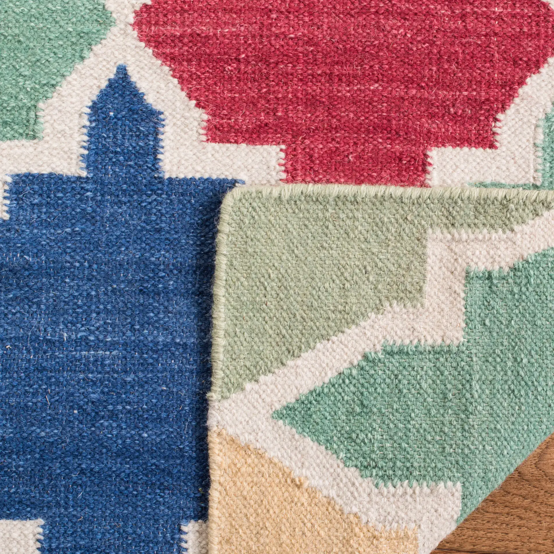 Dhurries Ogee Tile Hand-Woven Rug in Blue / Multicolor in a styled room