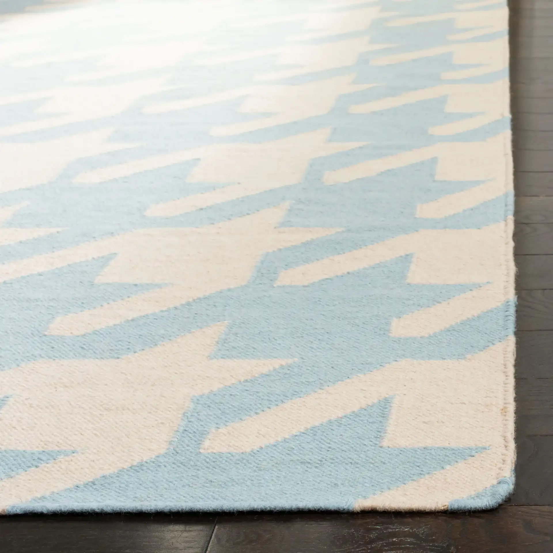 Dhurries Houndstooth Hand-Woven Wool Rug in Light Blue / Ivory in a styled room
