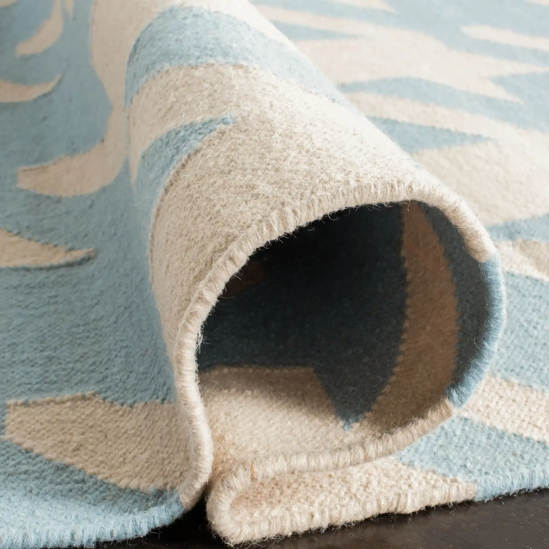 Dhurries Houndstooth Hand-Woven Wool Rug in Light Blue / Ivory in a styled room