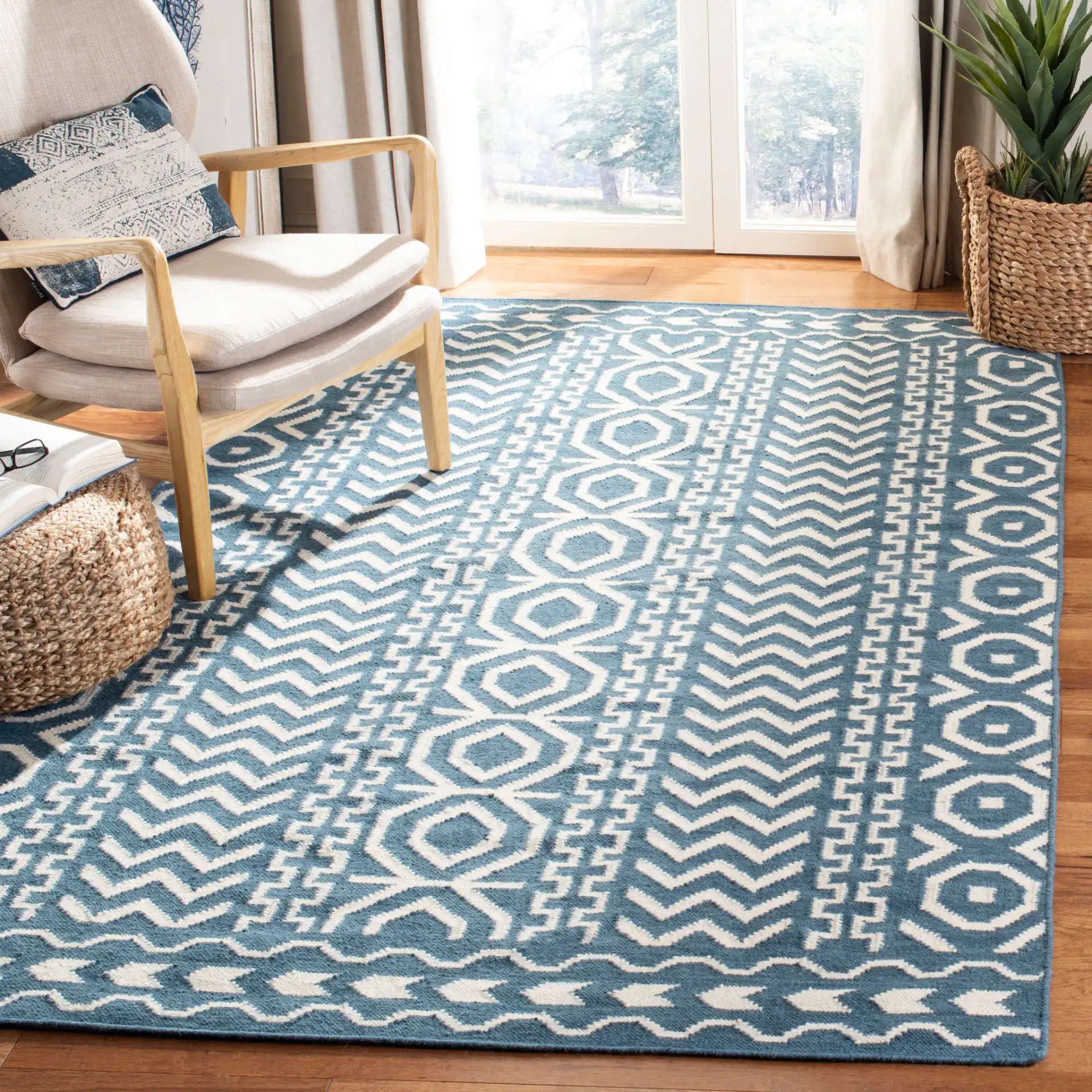 Dhurries Striped Chevron Hand-Woven Rug in Dark Blue / Ivory in a styled room