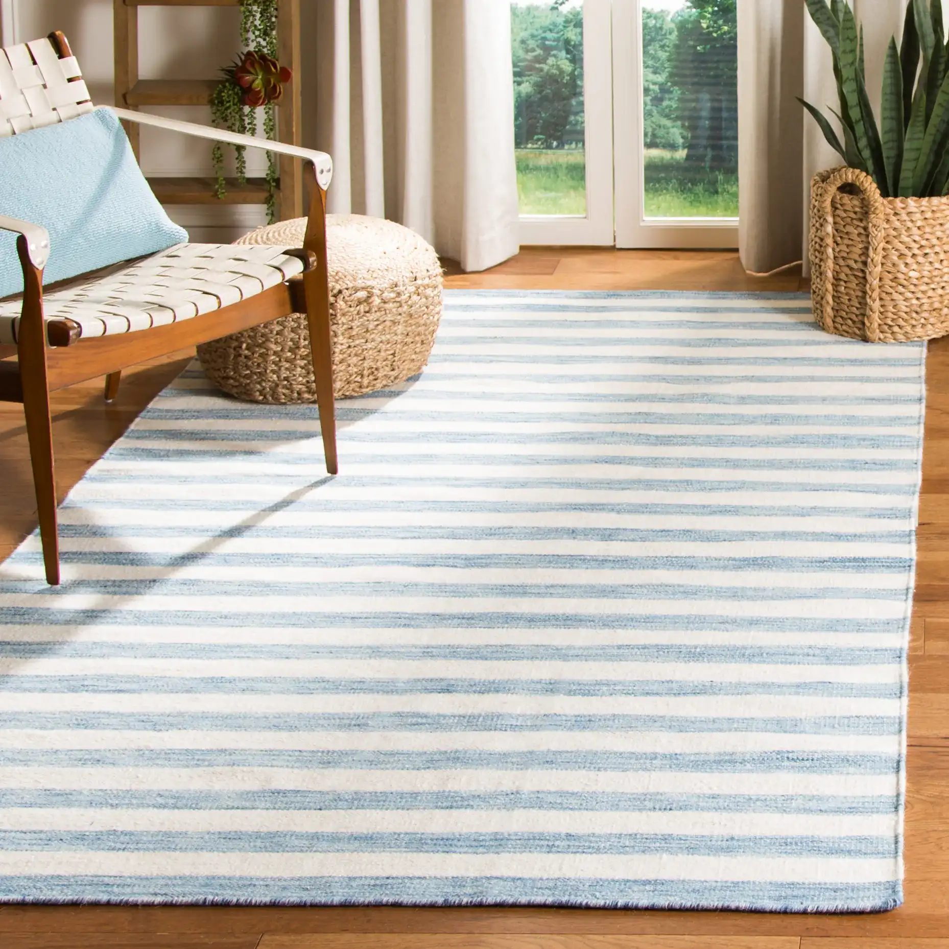 Dhurries Striped Hand-Woven Wool Rug in Blue / Ivory in a styled room
