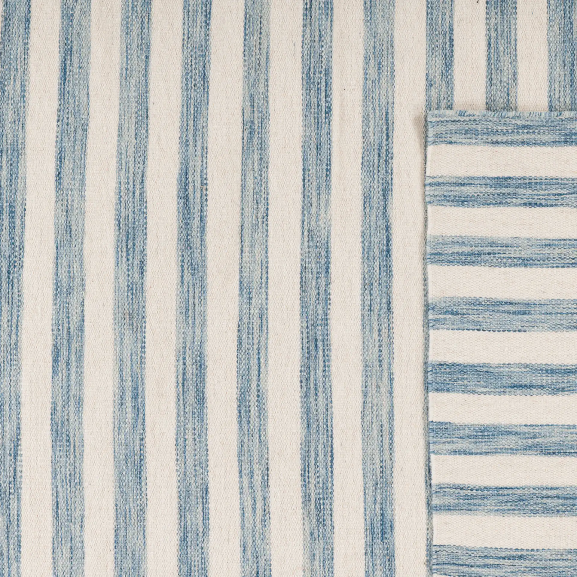 Dhurries Striped Hand-Woven Wool Rug in Blue / Ivory in a styled room