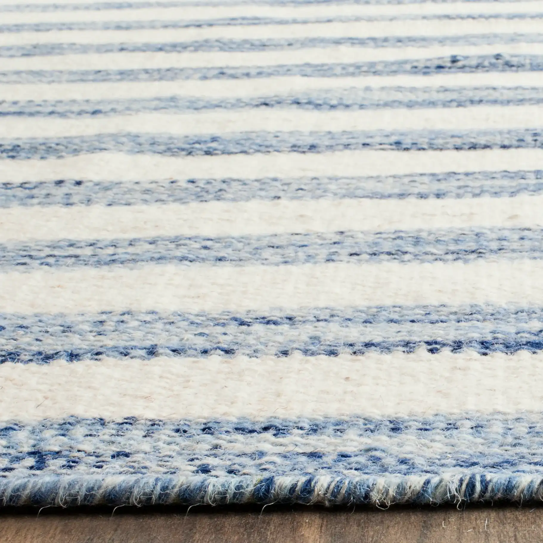 Dhurries Striped Hand-Woven Wool Rug in Blue / Ivory in a styled room