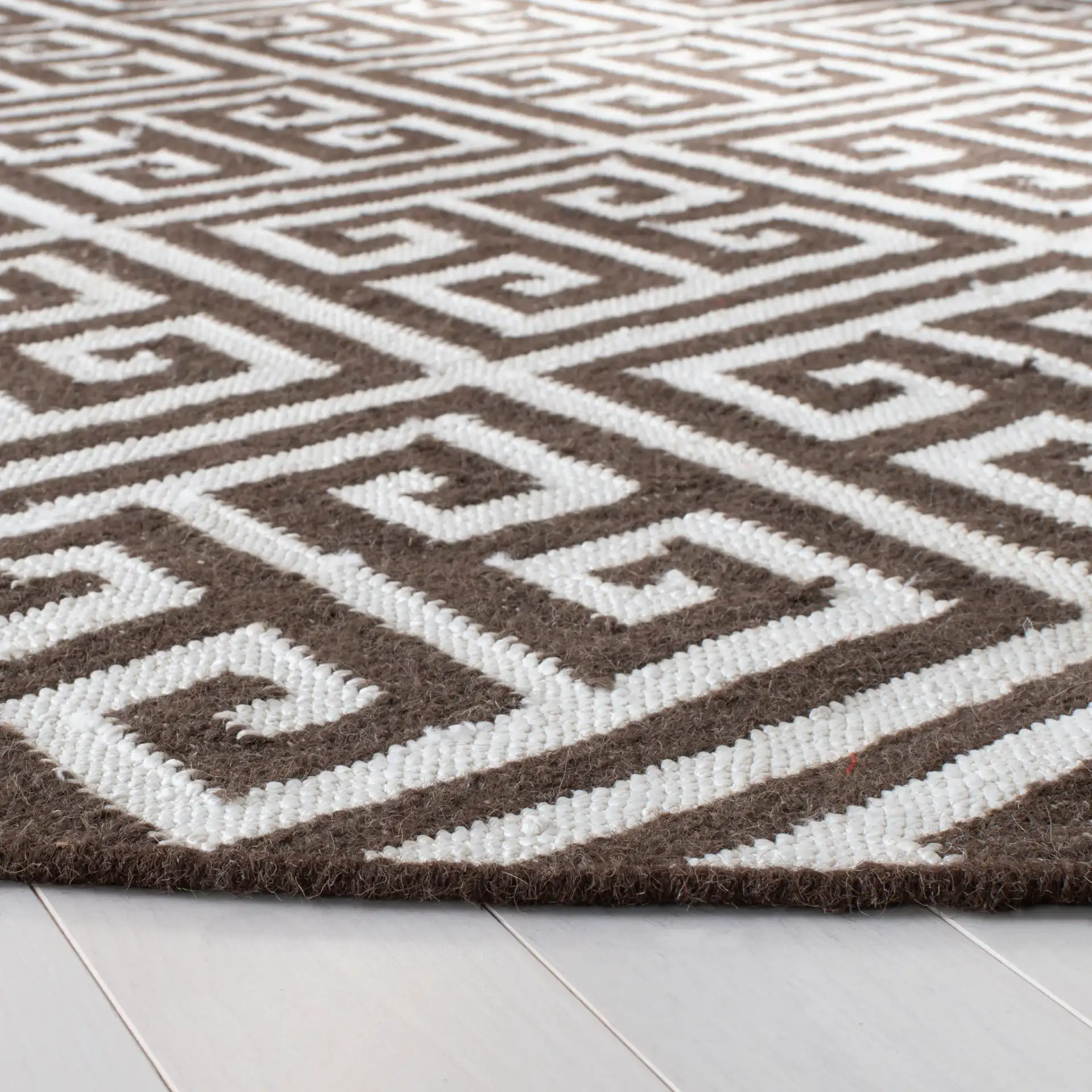 Dhurries Greek Key Hand-Woven Rug in Brown / Ivory in a styled room